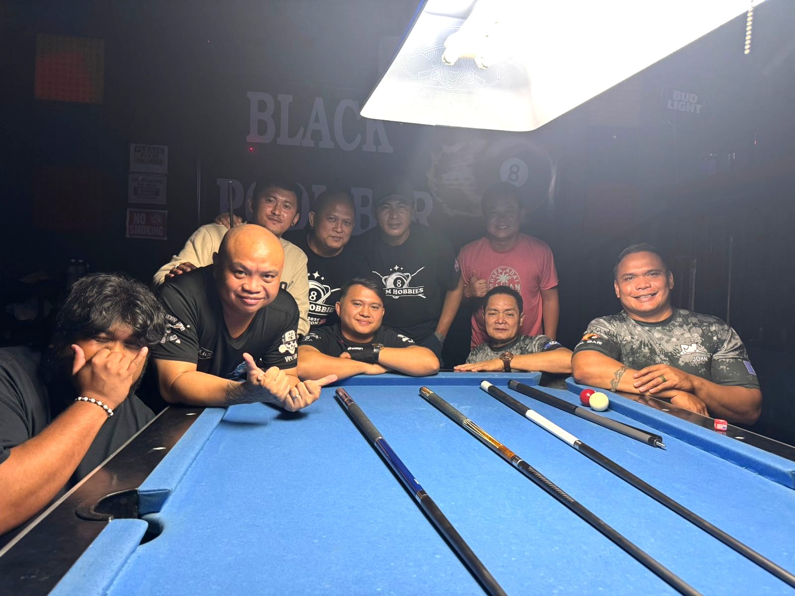 Last Shot Hobbies Sharks and Black 8 Crooked Arrow players pose for a group photo during a match in the Tuesday division of the SBA Budweiser Open 8-Ball League 2025 at Black 8 Pool Bar.Contributed photo