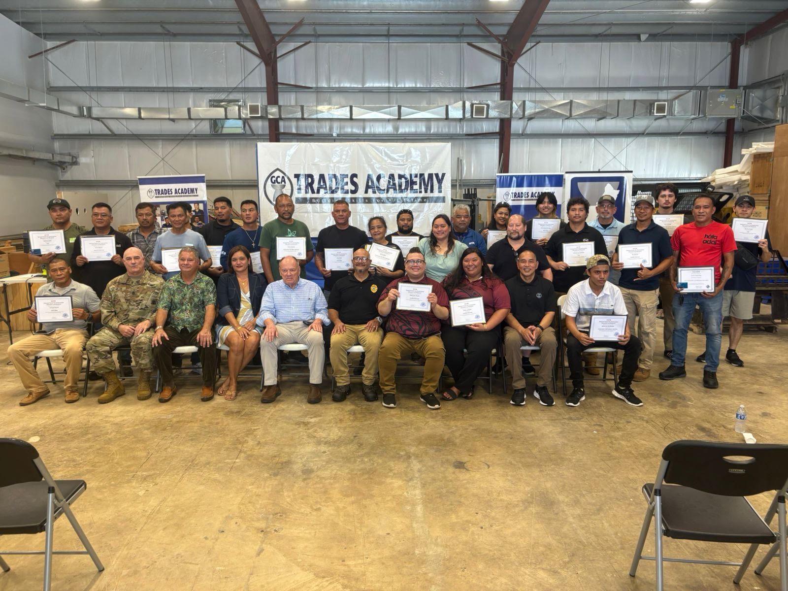 GCA Trades Academy graduates pose for a group photo.