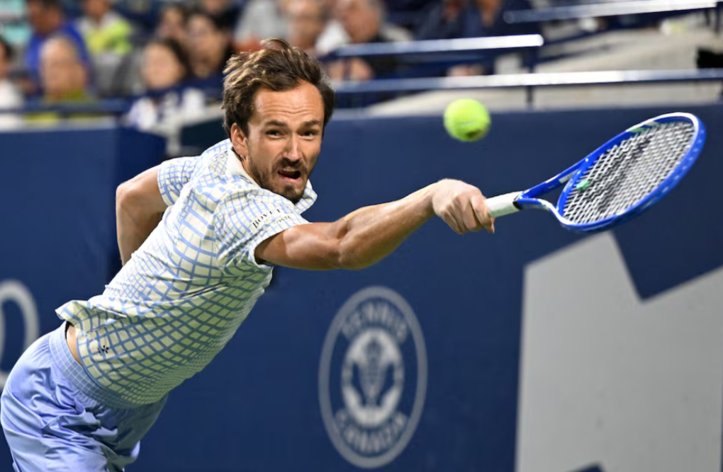 Daniil Medvedev of Russia plays a shot against Alexei Popyrin of Australia during third-round play at Sobeys Stadium in Toronto, Ontario, Canada on July 31, 2025.Photo by Dan Hamilton/Imagn Images