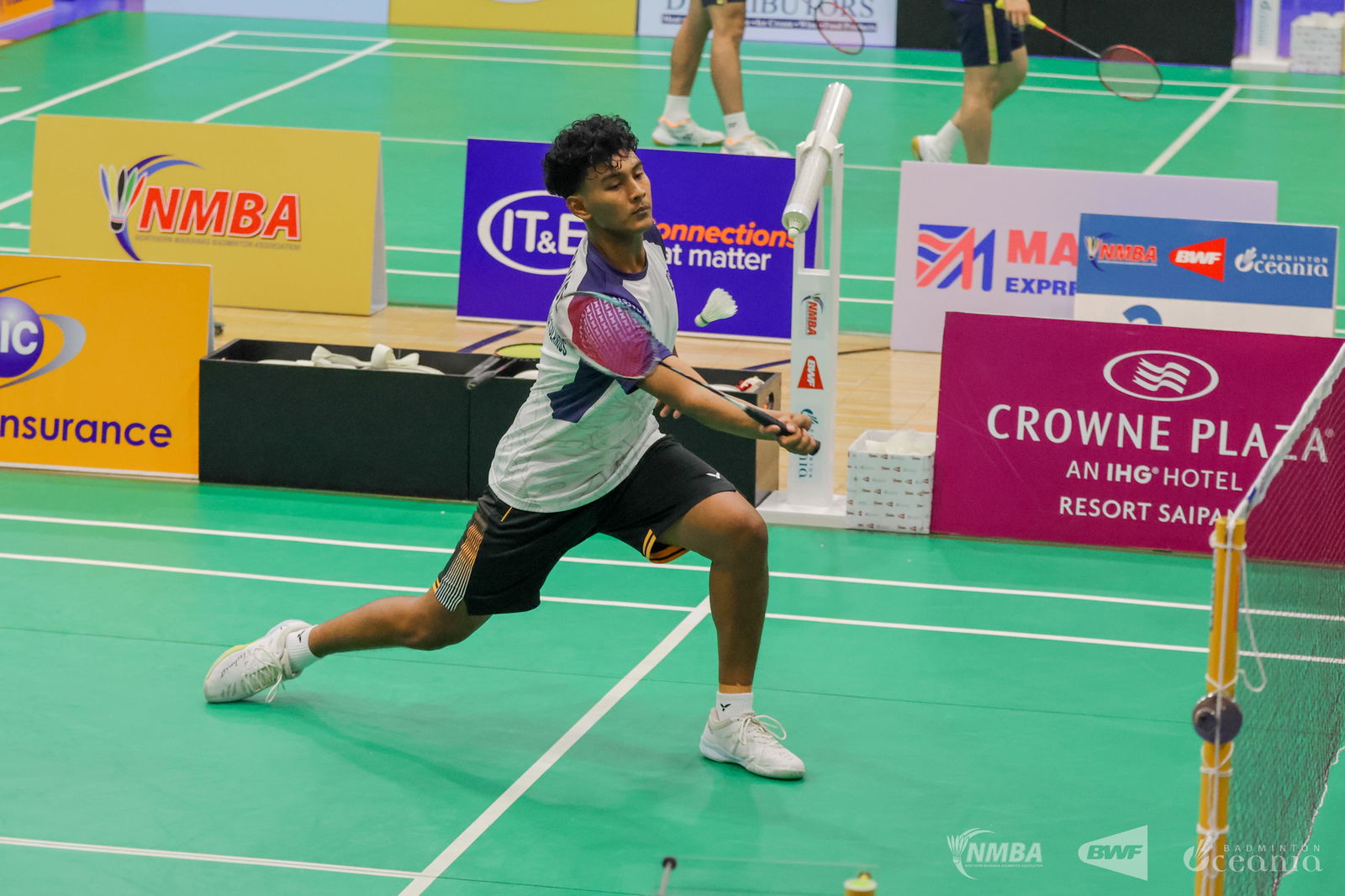 NMI’s Minul Hoque reaches out for a return during a men’s singles match at the Crowne Plaza Northern Marianas Open 2025, held at the Ada gym.Northern Marianas Badminton Association photo