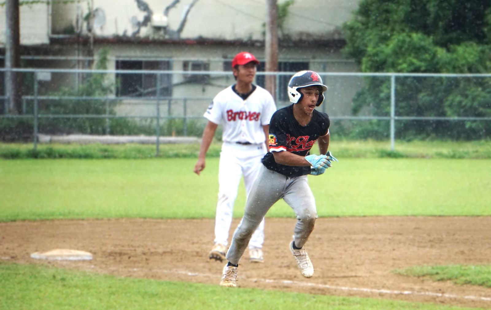 Ol'Aces Jr.'s Leighton Tenorio rushes toward home plate after a wild pitch by the Braves Jr. during the junior division championship game of the 2025 Saipan Little League Baseball at the Francisco "Tan Ko" Palacios Baseball Field on Saturday.
