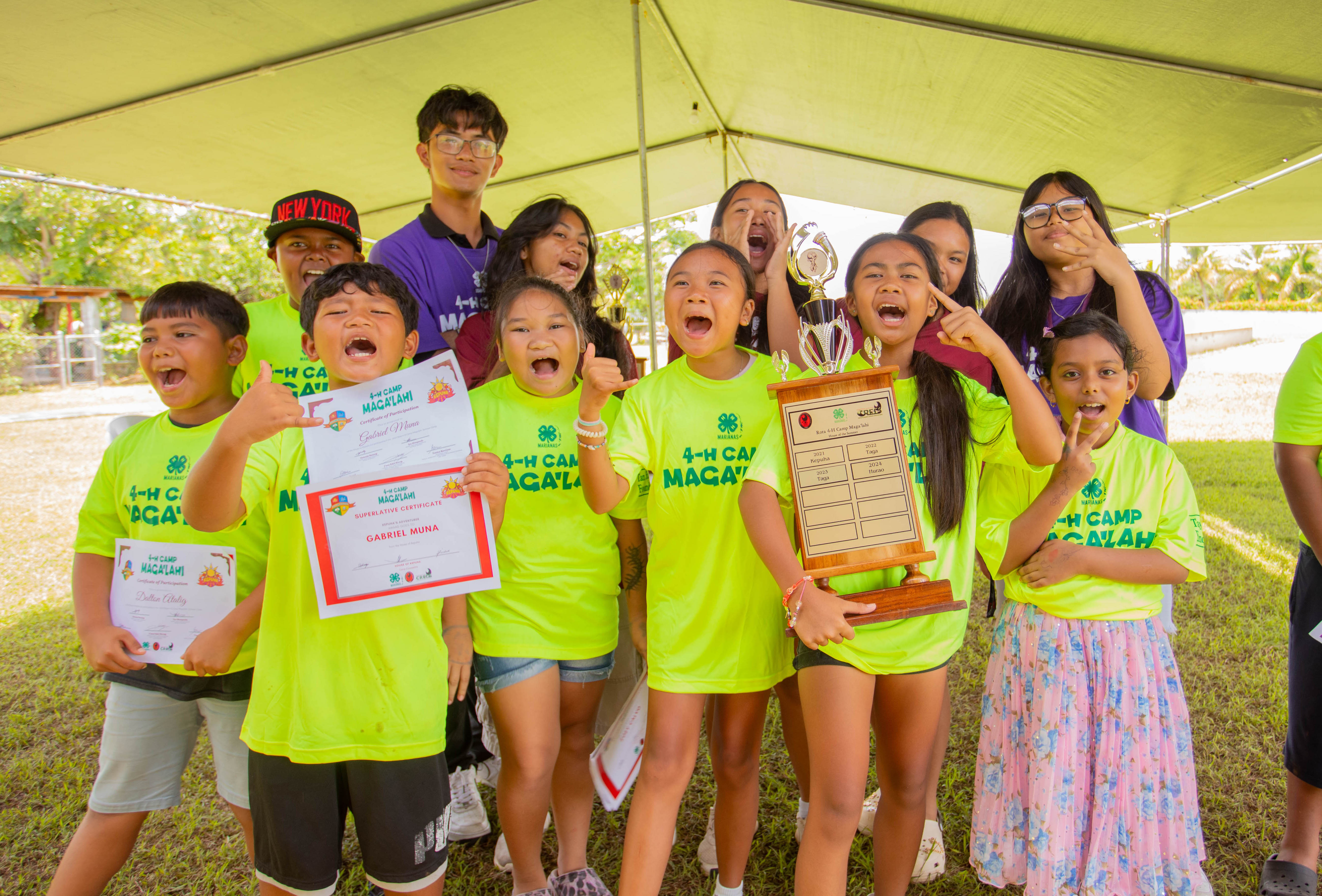 4-H Camp Maga’lahi pride thrives in Rota as 4-H Juniors from the House of Kepuha show off their House of the Summer trophy and certificates on their final session on July 11, 2025.