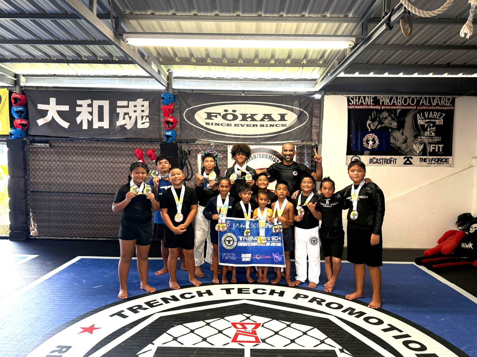 Front row, from left: Iris Quitugua - double silver;  Jordan Camacho - bronze; Avah Igitol - double bronze; Uma Naputi - silver; Athena Feger- gold and silver; Vic Igitol - silver and bronze; Jerome Cruz - bronze; Deighton Muna; Noel Quitugua - silver. Back row, from left: Gerard Naputi - silver and bronze; Trey Manglona - silver; Justo Quitugua - silver; and Joseph Cruz.Contributed photo