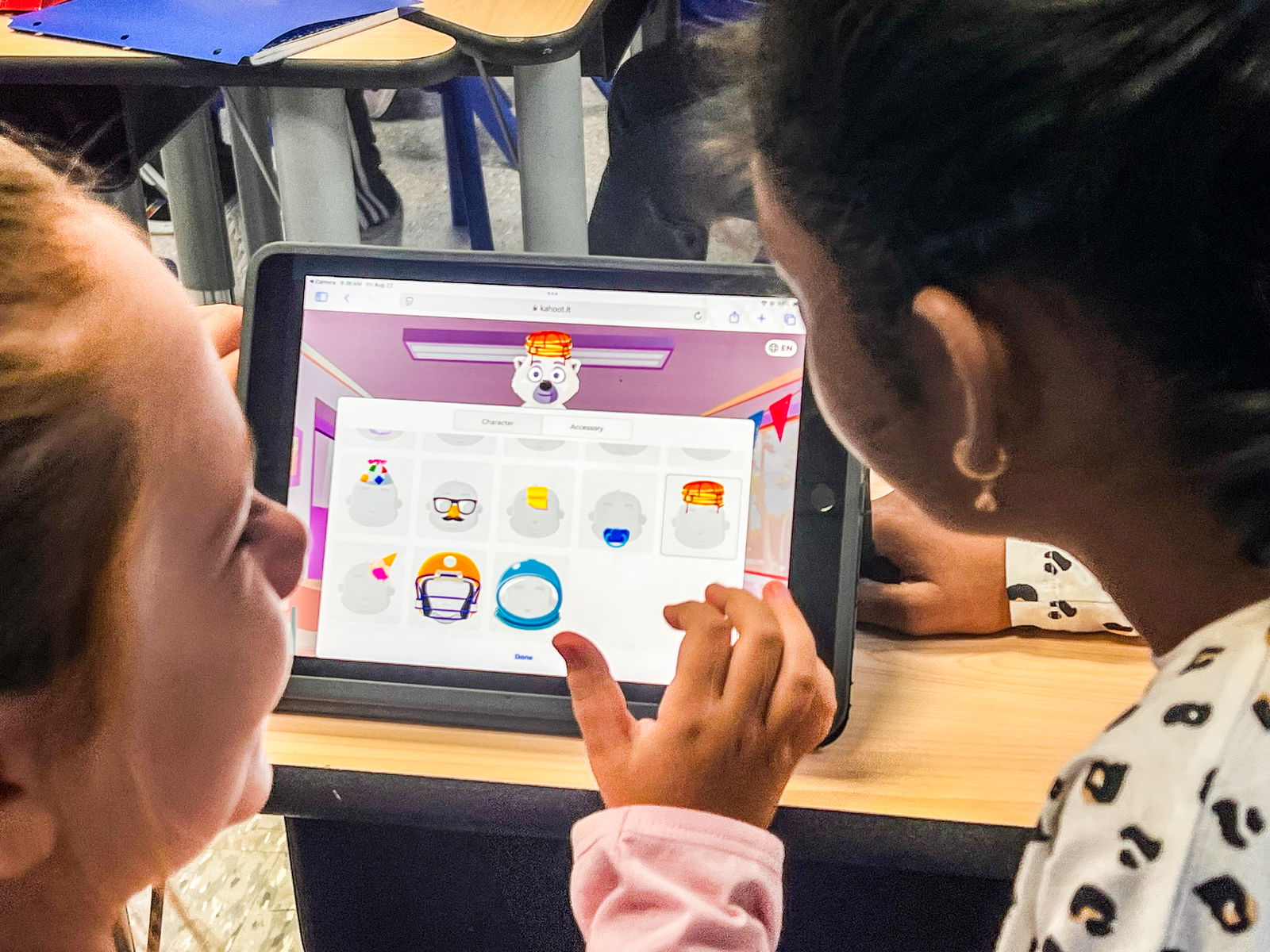 Two students collaborate on a classroom activity, using technology to enhance their learning.