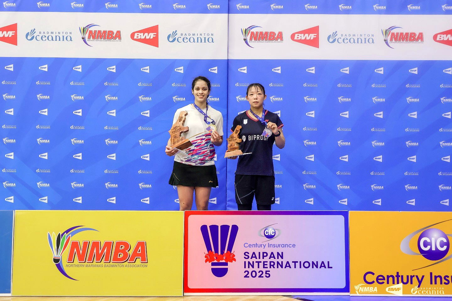 India’s Tanya Hemanth and Japan's Kanae Sakai pose as the first and second-place finishers in the Women's Singles event of the Century Insurance Saipan International 2025 at the Ada gym on Saturday.NMBA photo