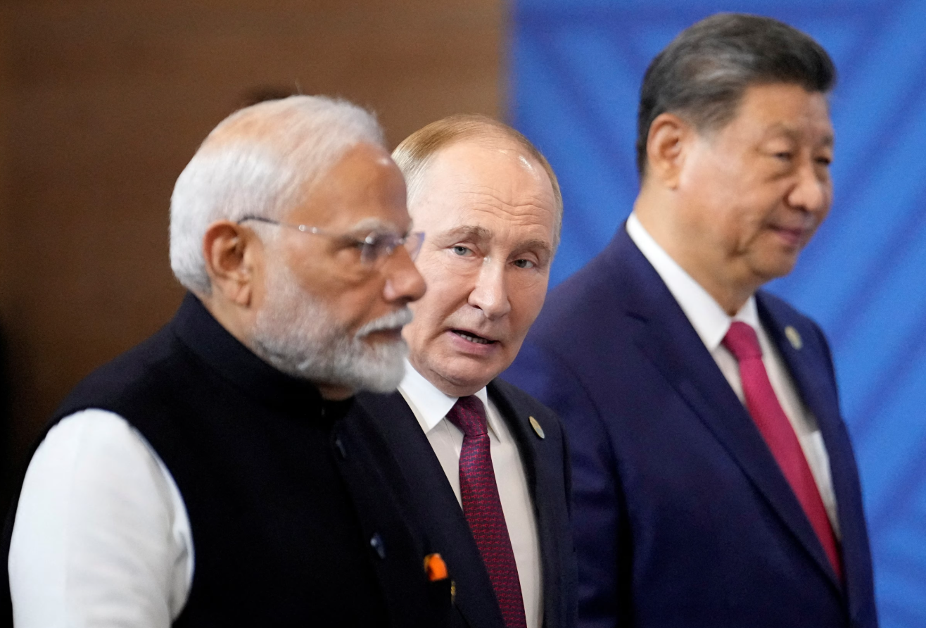 Indian Prime Minister Narendra Modi, Russian President Vladimir Putin and Chinese President Xi Jinping attend a group photo ceremony prior to the BRICS Summit plenary session in Kazan, Russia, Oct. 23, 2024.REUTERS