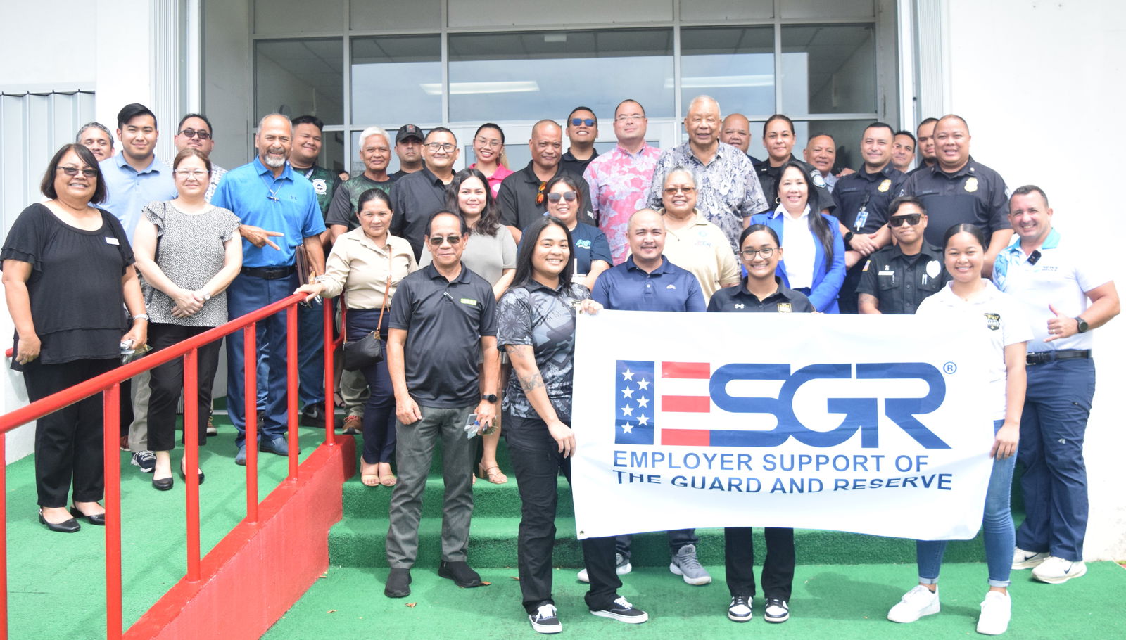 Gov. David M. Apatang and Speaker Edmund S. Villagomez pose with Employer Support of the Guard and Reserve Guam-CNMI State Committee Area Chair Joann T. Aquino, ESGR volunteers and service members, and their employers after a proclamation signing ceremony at the governor’s office on Monday.Photo by Emmanuel T. Erediano
