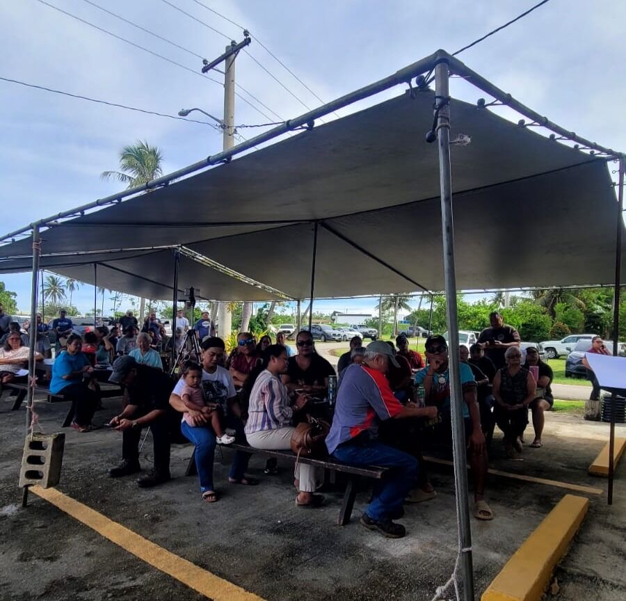 Tinian residents wait for the start of the lottery draw.