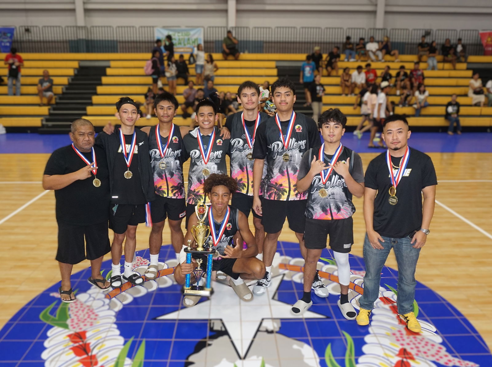 TurnKey Solution players pose with the U18 boys championship trophy of the 2025 Allied Pacific Environmental Consulting Basketball League during the awards ceremony at the Ada gym on Thursday night.Photo by James F. Sablan Jr.