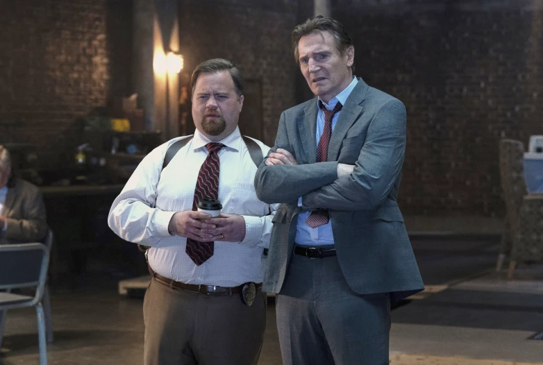 Paul Walter Hauser, left, and Liam Neeson in a scene from “The Naked Gun.”Paramount Pictures via AP