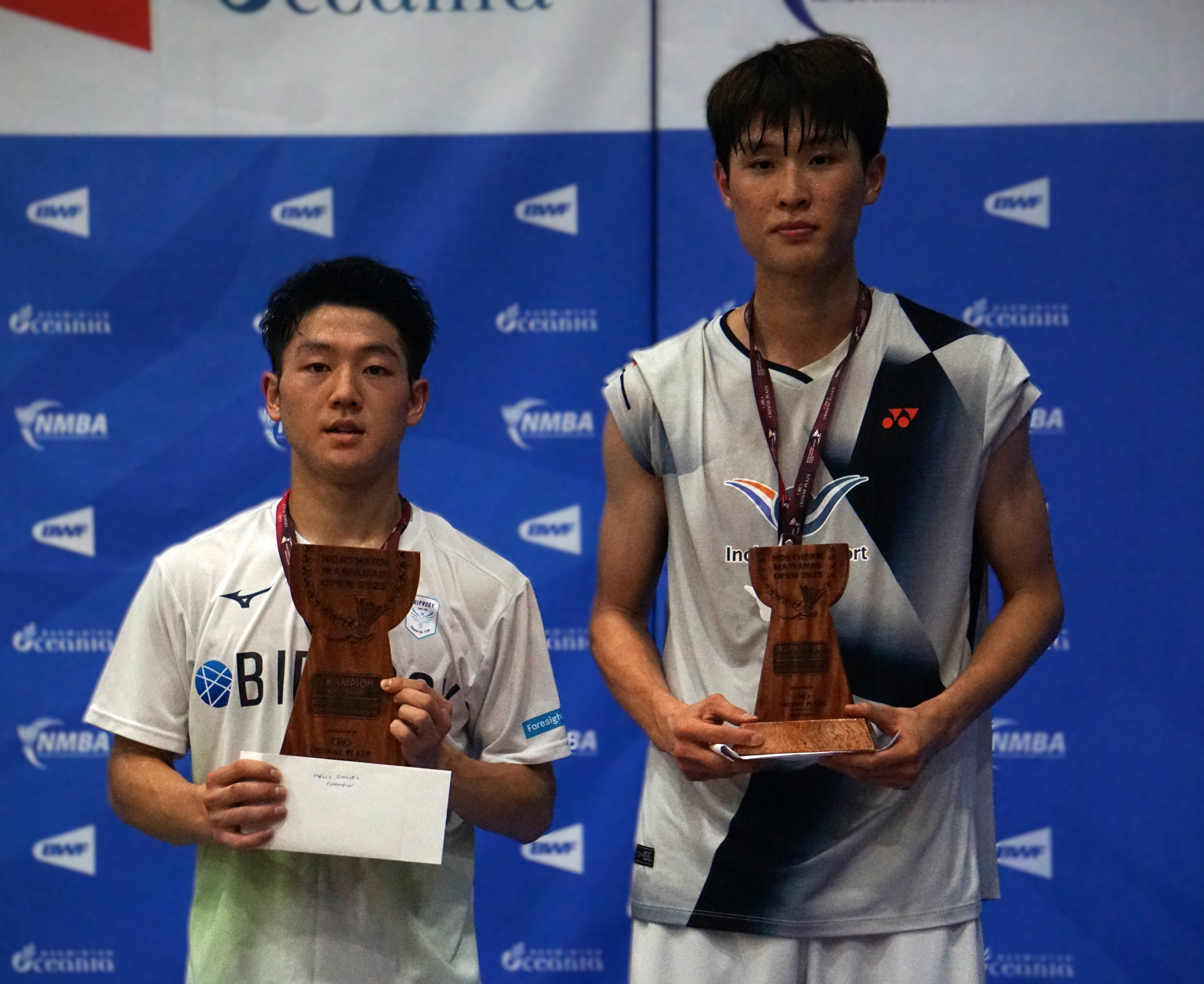 Japan's Yudai Okimoto and South Korea's Hae Duen Kim are the first and second place winners in the Men's Singles event of the Crowne Plaza Northern Marianas Open 2025 at the Ada gym on Sunday.