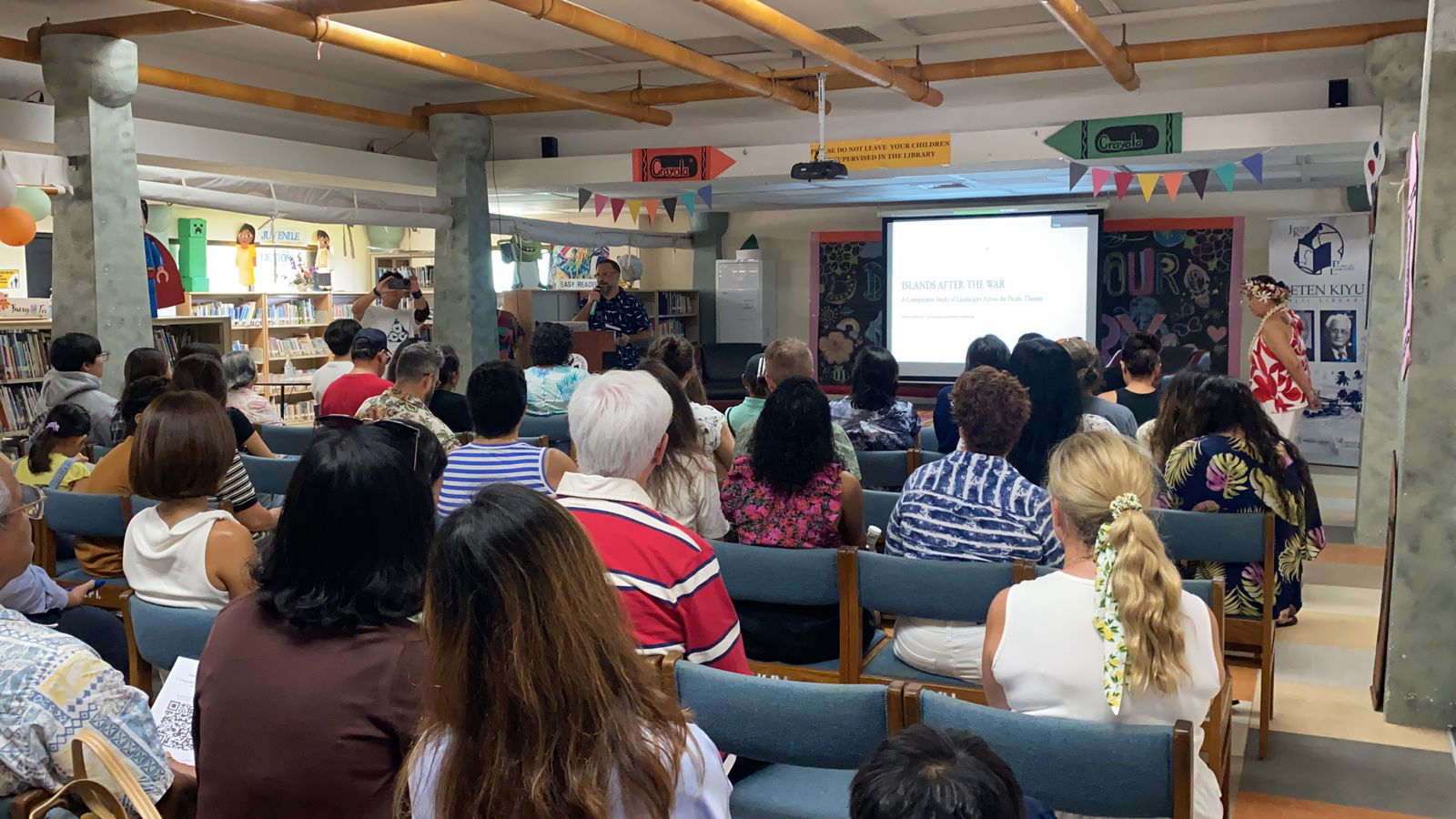 Island residents attend the book launch of “Islands After the War” at Joeten-Kiyu Public Library on Saturday, Aug. 16, 2025.