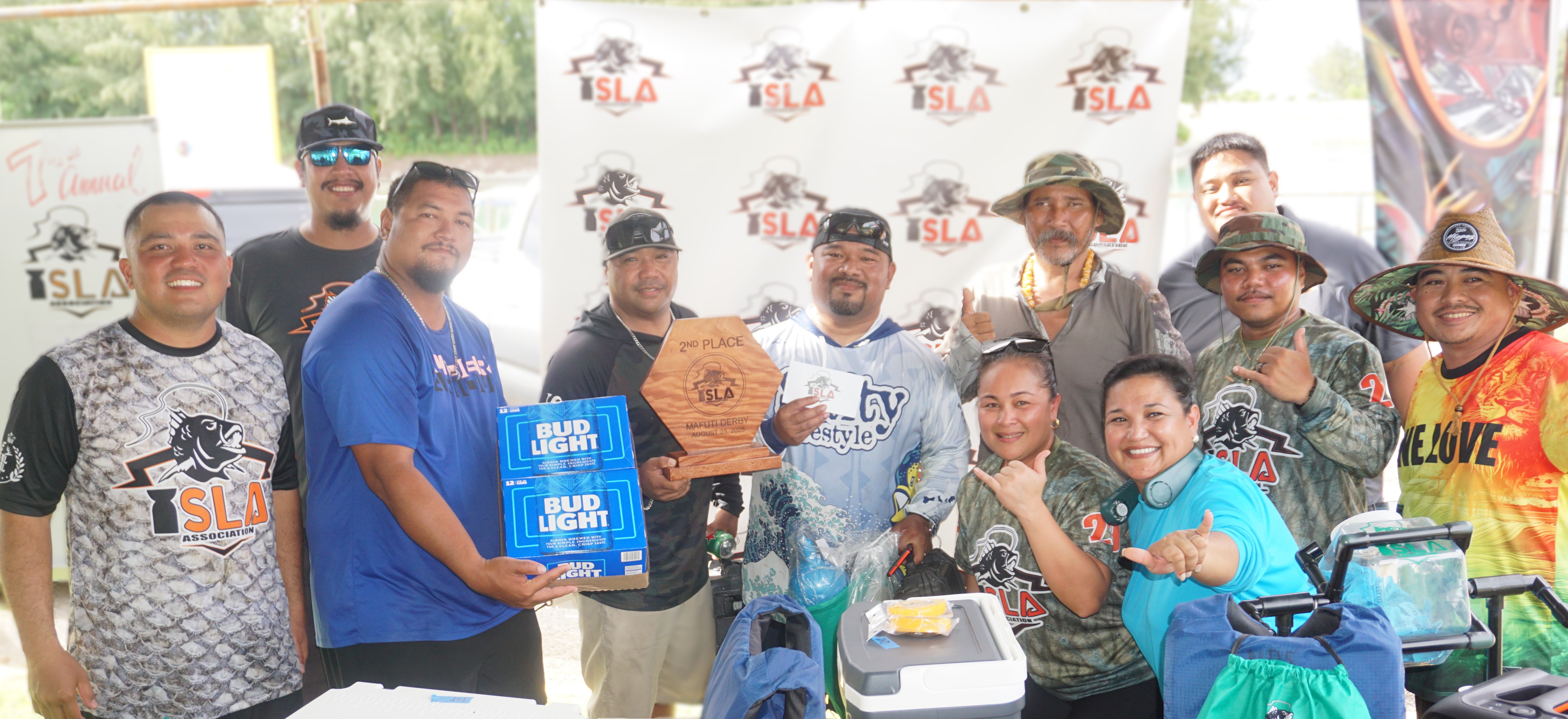 The crewmembers of Reelly pose with the 2nd Place Biggest Catch trophy alongside ISLA members during Saturday’s 7th Annual Mafuti Derby awards ceremony at Smiling Cove Marina.