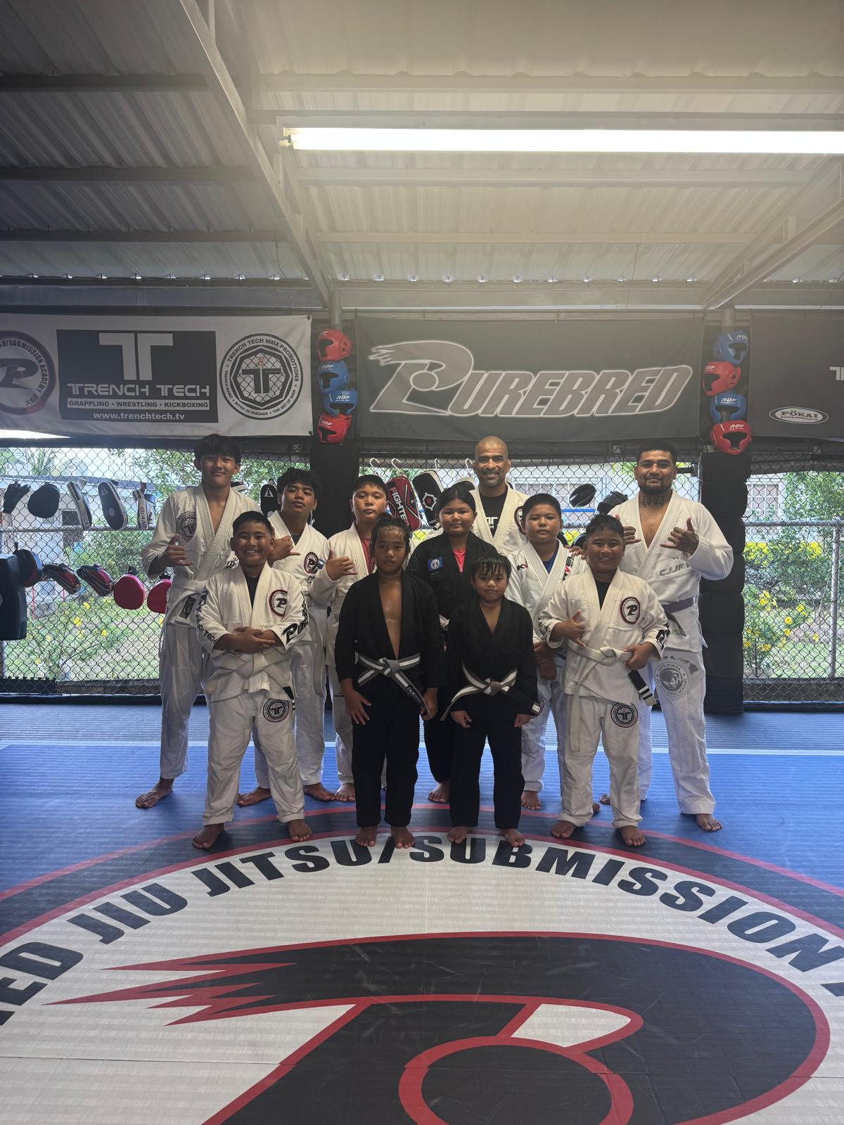 Some of the members of Team Trench Tech Purebred Saipan, who will be competing in the Påtgon Jiu Jitsu Tournament this Saturday, pose for a group photo at the Trench Tech gym.Contributed photo
