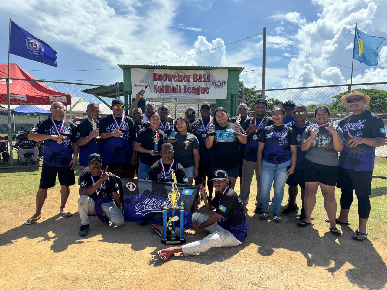 Asahi players pose with the masters division championship trophy of the 2025 Budweiser Belau Amateur Softball Association League on Sunday at the Dandan ball field.Contributed photo