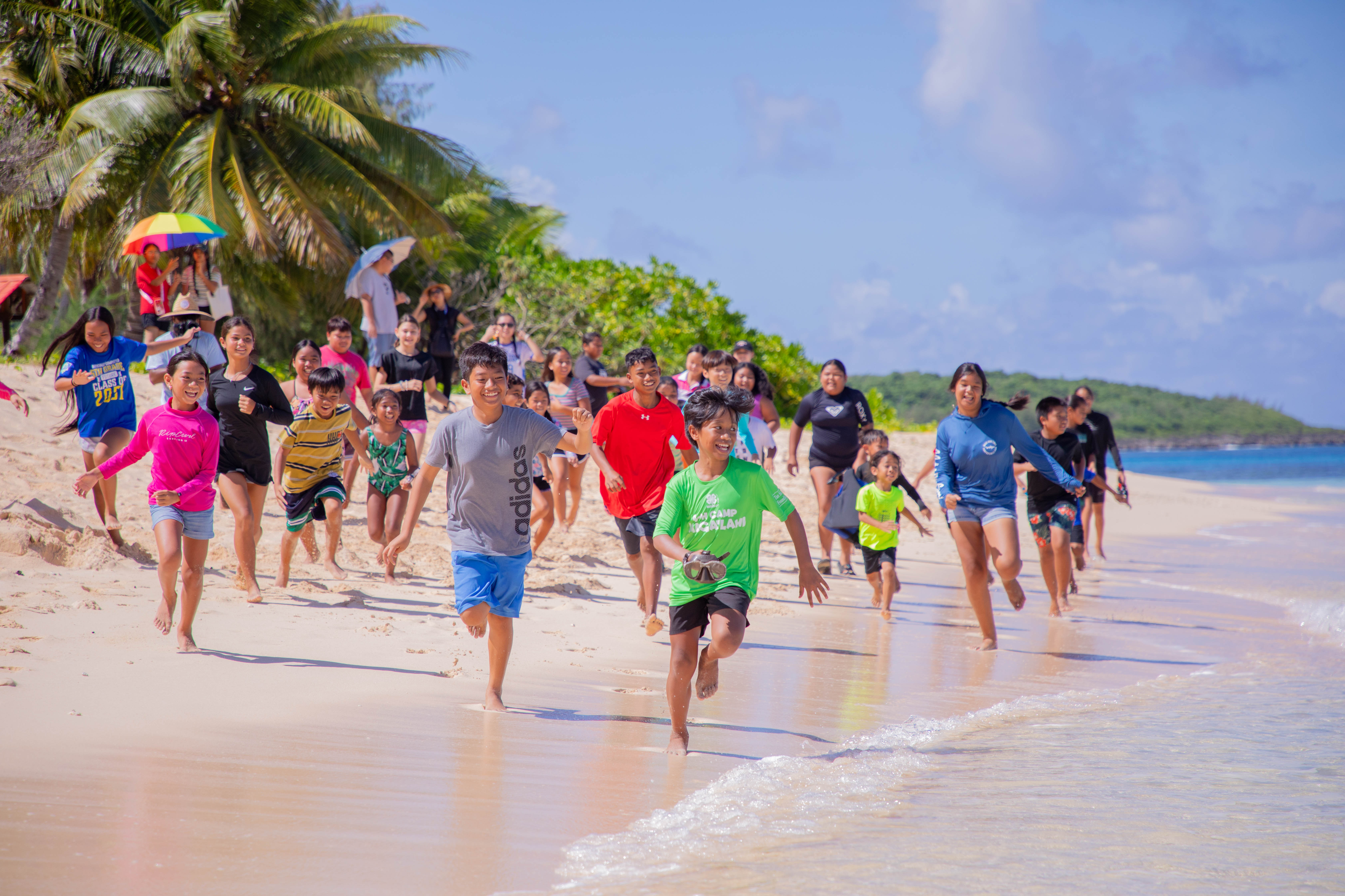 Jump in! Campers and counselors on Tinian go in for a splash at Tachogna Beach for their water activities on July 17, 2025.