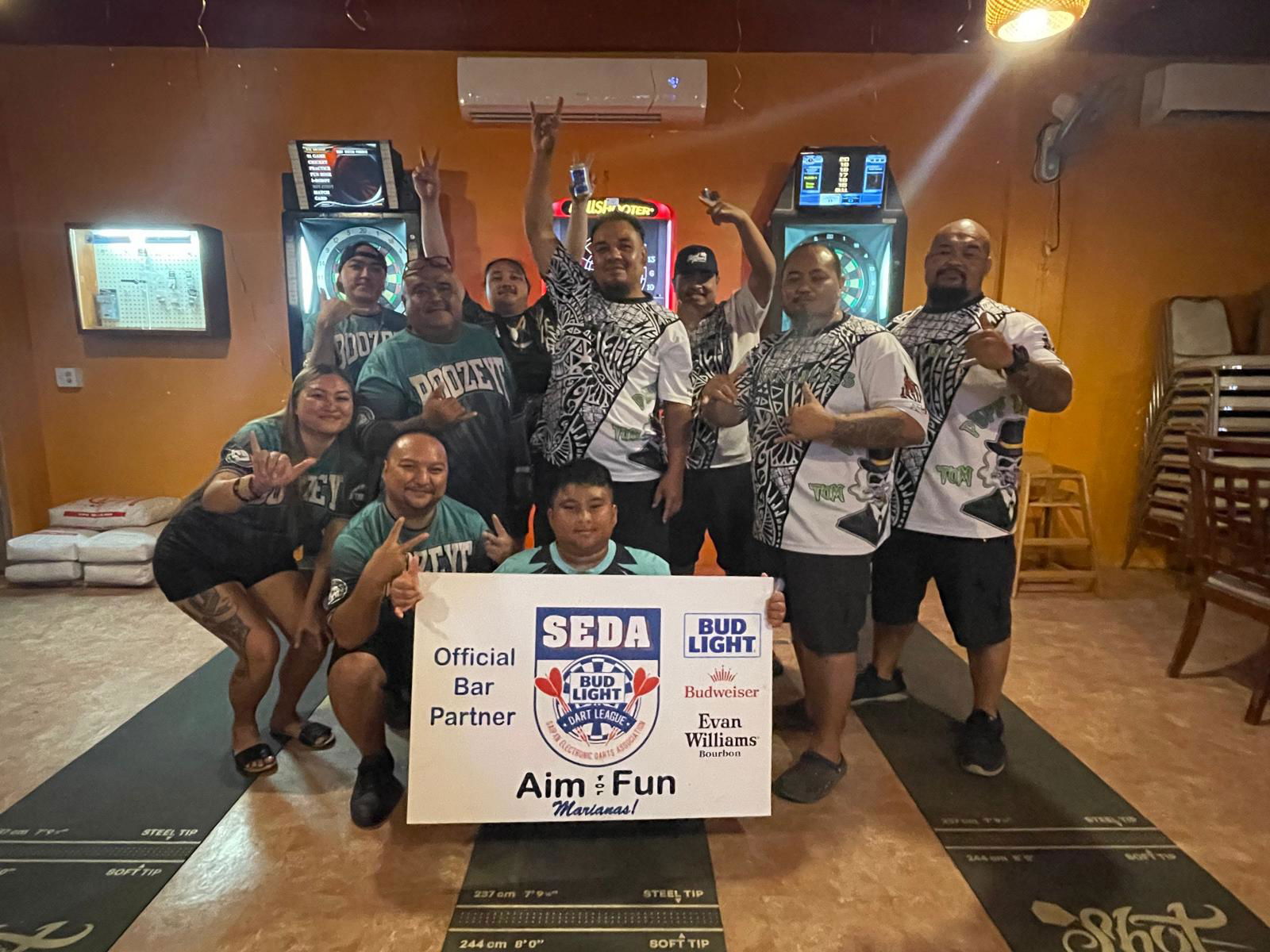 Tom Yum Puff Daddy and Jonny's Boozeye players pose for a group photo after their match in the Flame Tree B Division of the 2025 SEDA Bud Light Dart League at the Tom Yum Restaurant on Thursday night.Contributed photo