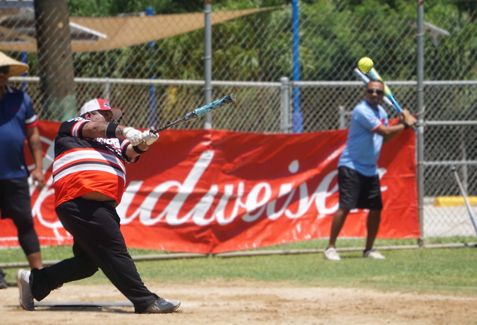 Manny Sablan of Man Amigos hits a home run in the masters division quarterfinal against Hagu Lamun at Dandan ball field on Sunday.