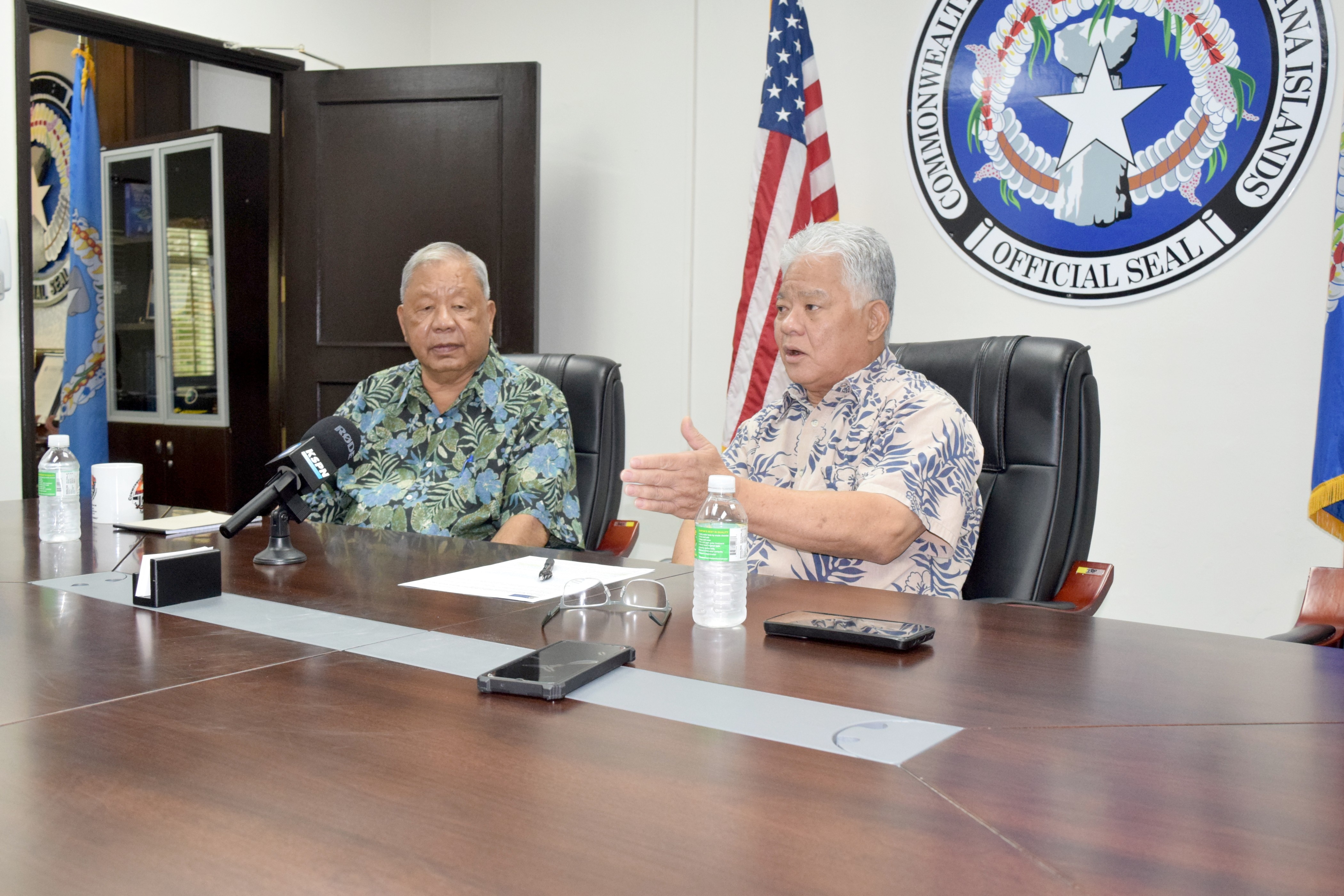 Gov. Arnold I. Palacios speaks as Lt. Gov. David M. Apatang listens during a press conference on Capital Hill.