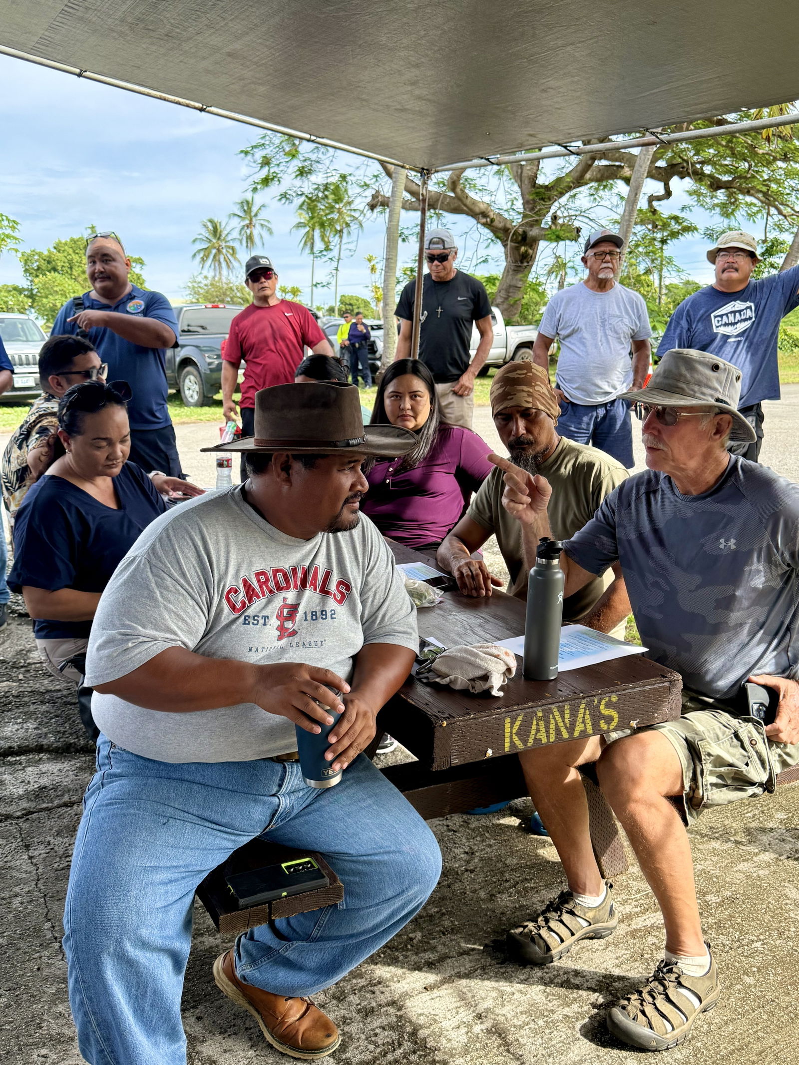 Tinian residents wait their turn to draw lot numbers.