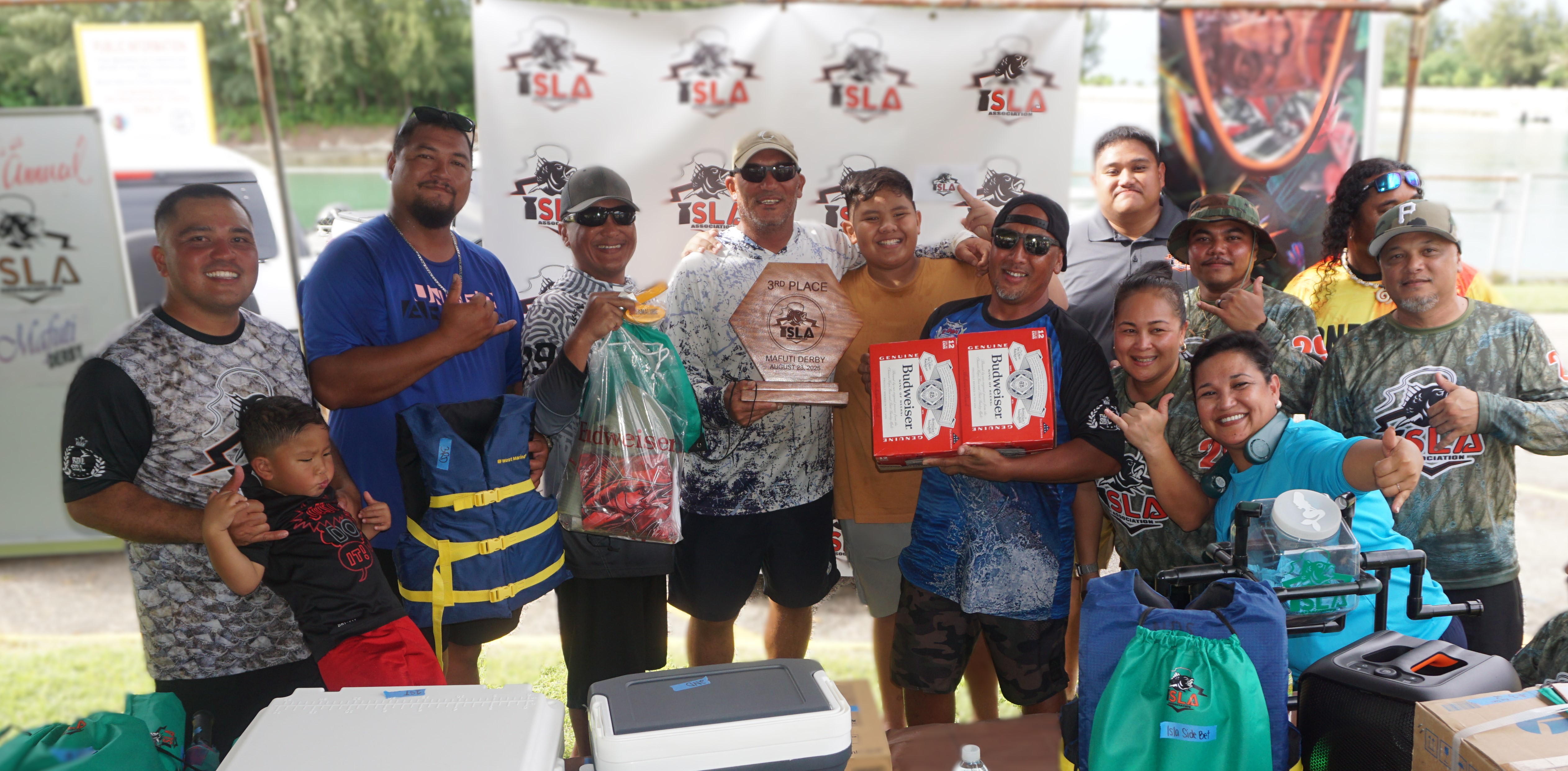 The crewmembers of Sunrisers pose with the 3rd Place Biggest Catch trophy alongside ISLA members during Saturday’s awards ceremony of the 7th Annual Mafuti Derby at Smiling Cove Marina.