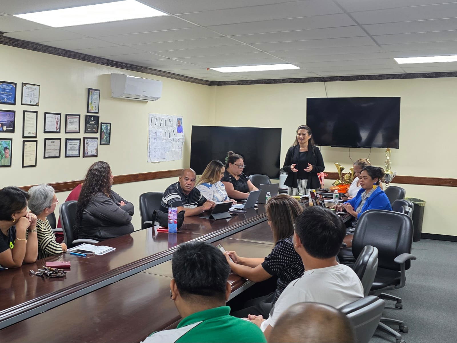 The Liberation Day Committee with their attorney Janet King, standing, and vendors meet in the Saipan Mayor’s Office conference room on Aug. 19, 2025.