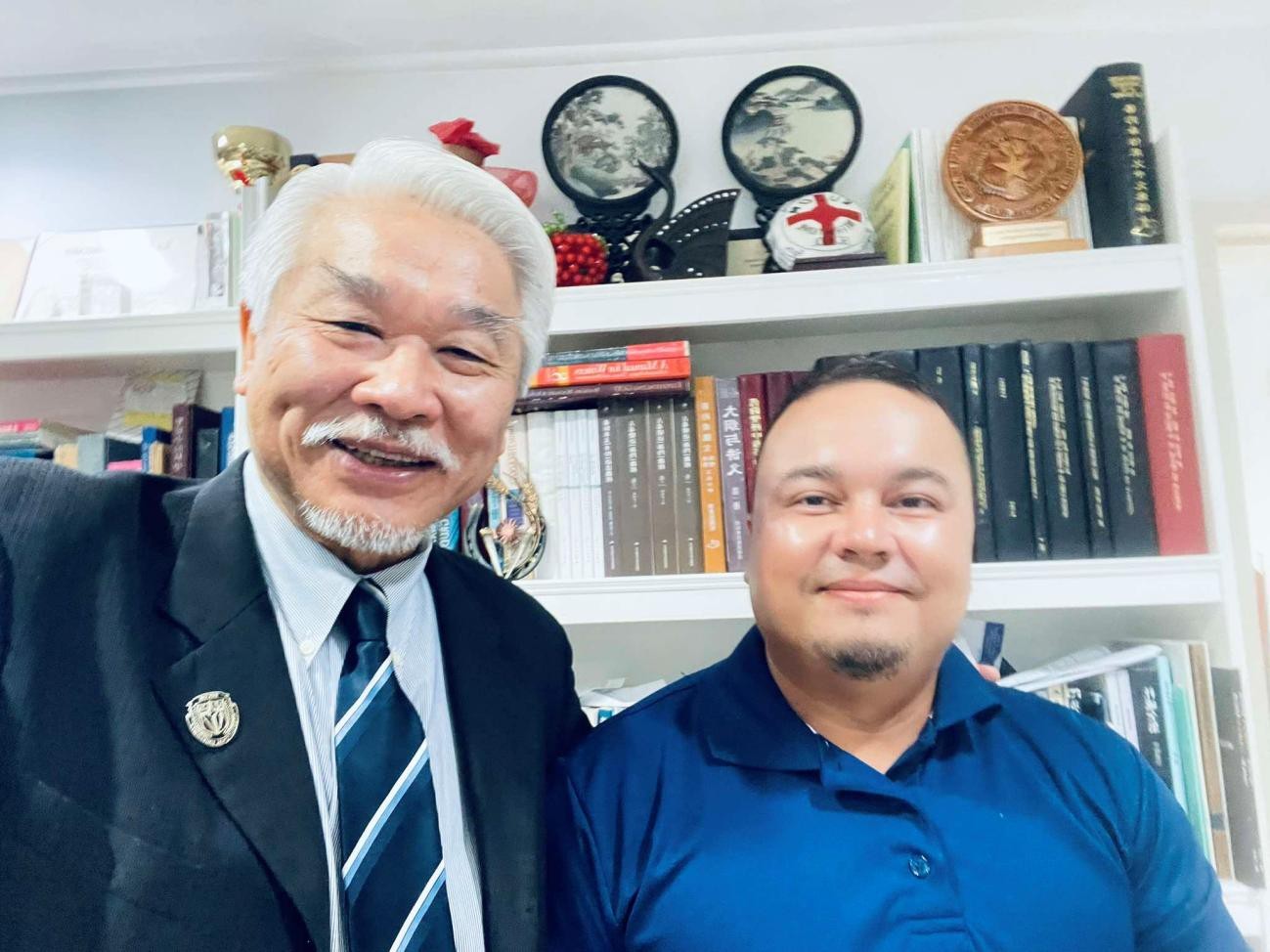 EUCON President Dr. Christian Wei, left, with Vinson Deleon Guerrero.EUCON photo