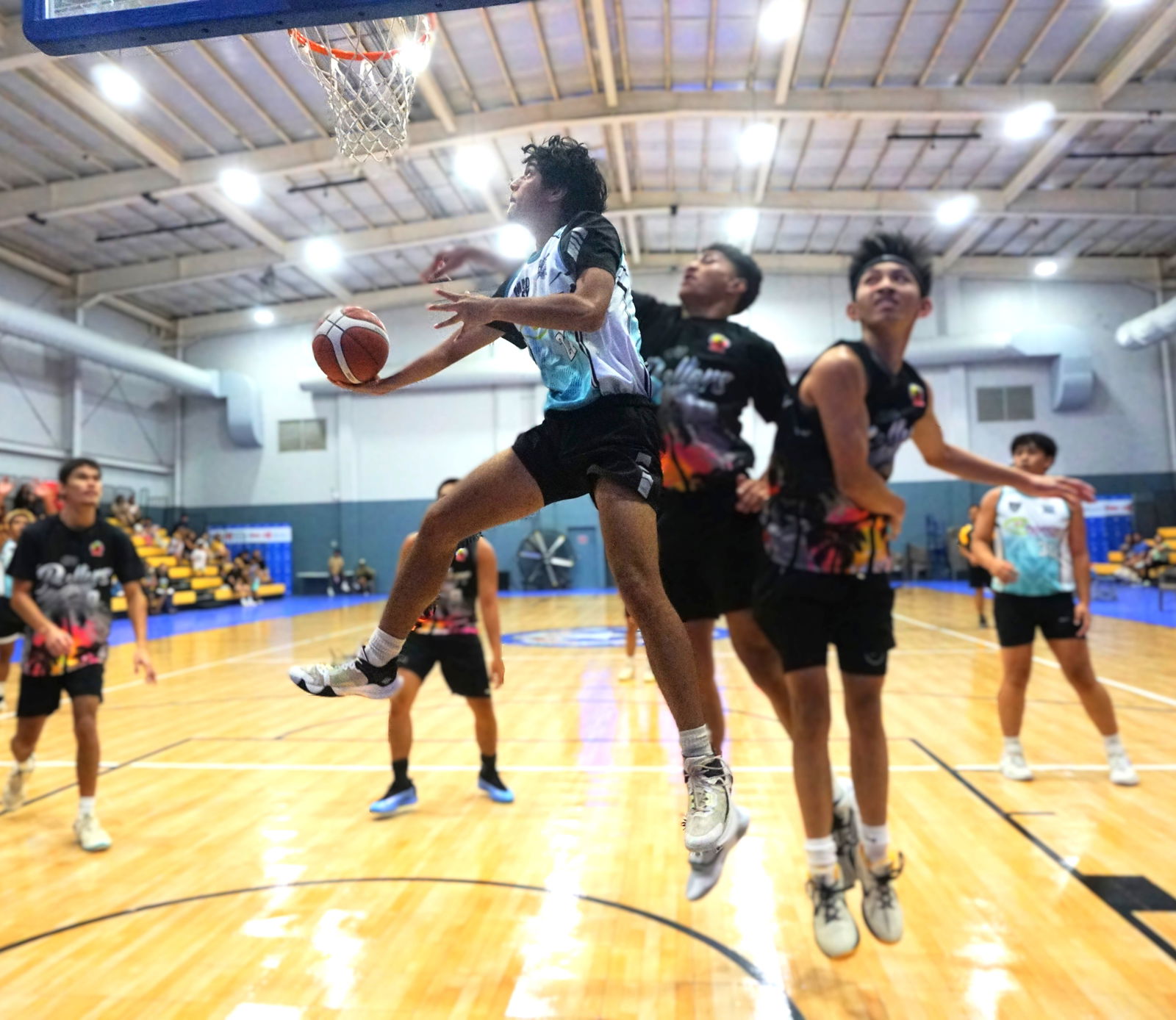 Hardt Eye's Ibrahim Ibarola goes for the reverse layup against TurnKey Solution during the U18 boys championship game of the 2025 Allied Pacific Environmental Consulting Basketball League at the Ada gym on Thursday night.Photo by James F. Sablan Jr.