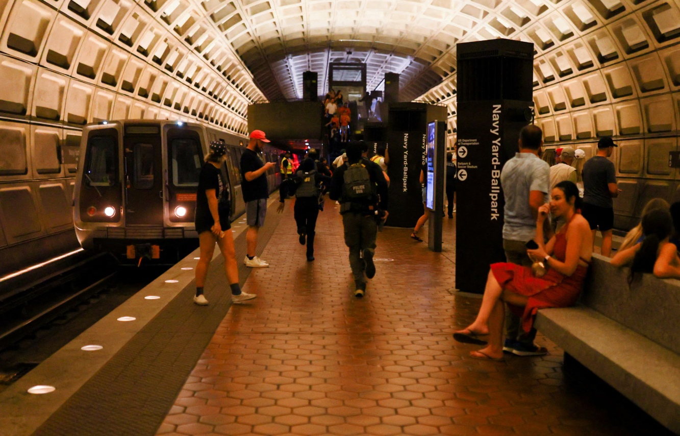 Members of the FBI and the Diplomatic Security Service run at the Navy Yard–Ballpark metro station in Navy Yard in Washington, D.C., Aug. 15, 2025.REUTERS