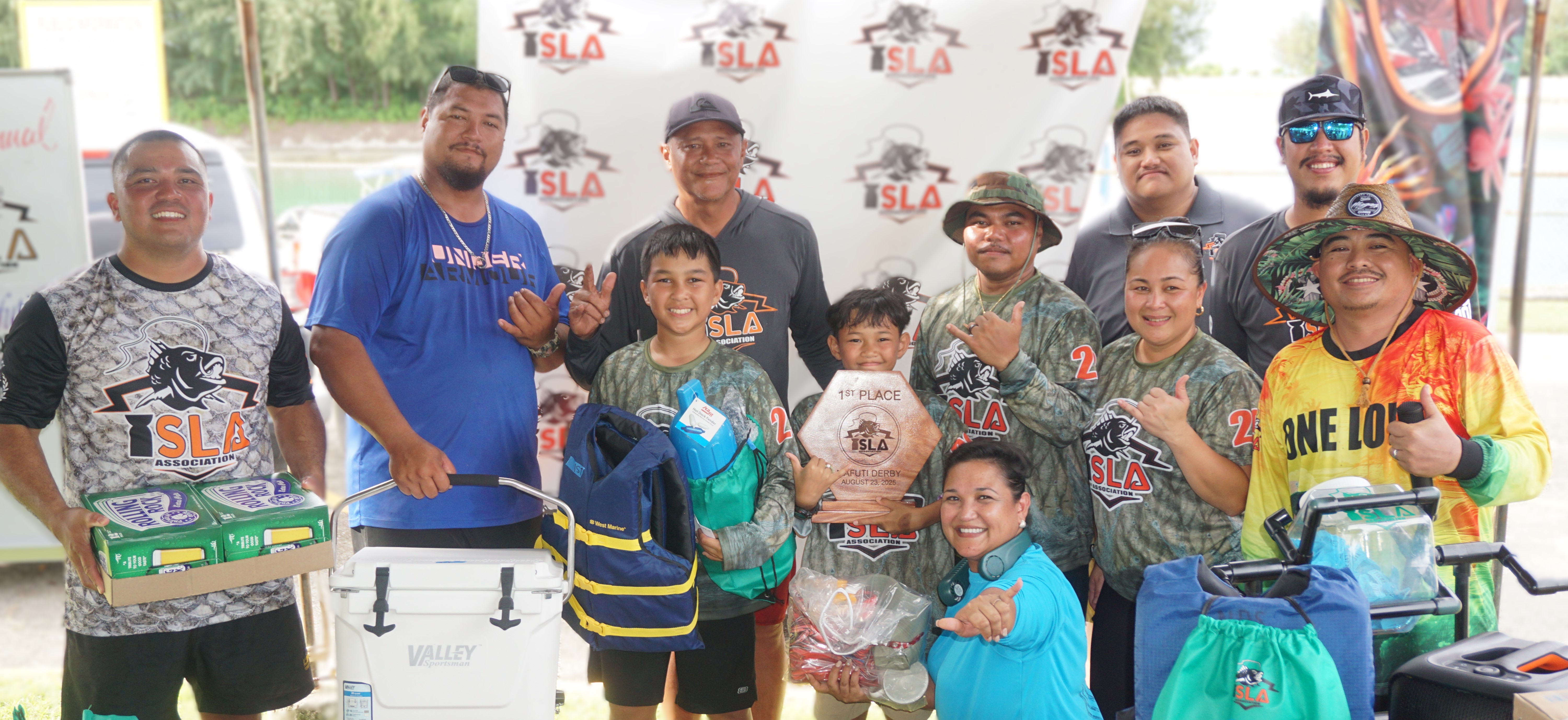 Crewmembers of the Nibbler celebrate their 1st place Biggest Catch win with ISLA members at the awards ceremony of the 7th Annual Mafuti Derby, held Saturday at Smiling Cove Marina.