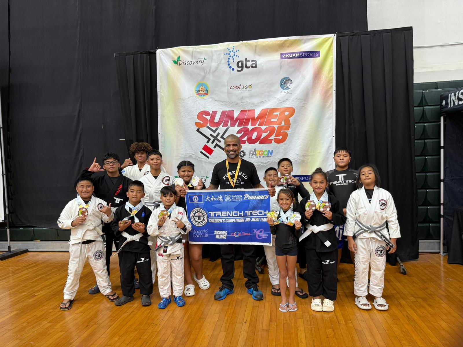 Trench Tech Purebred Saipan team members pose with their medals after the 2025 Påtgon Jiu Jitsu Tournament on Saturday at UOG Field House in Mangilao, Guam.