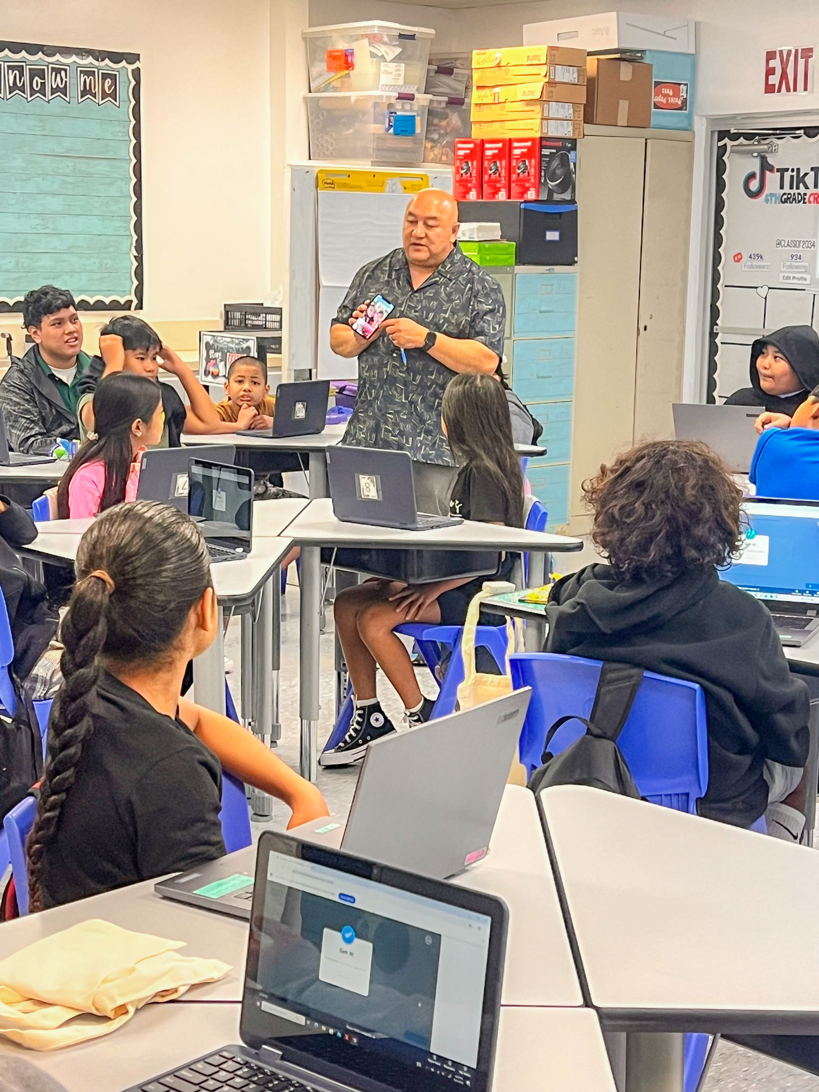 Students at Tinian Elementary School listen as Commissioner of Education Dr. Lawrence F. Camacho talks about using technology safely in the classroom.