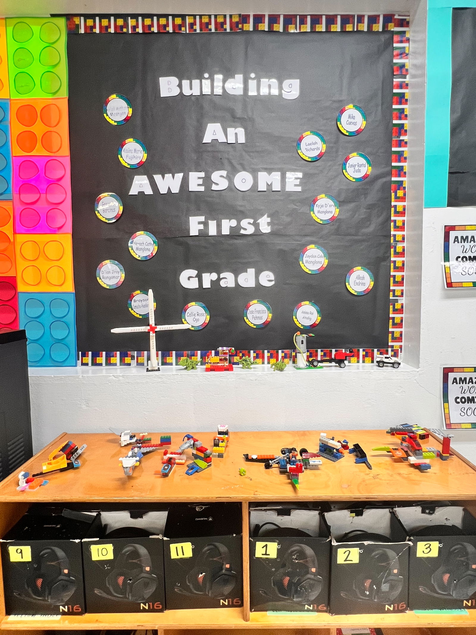 A student corner at Sinapalo Elementary School features a creative mix of cutout classroom resources, Lego blocks, and modern headphones to support technology-based learning.