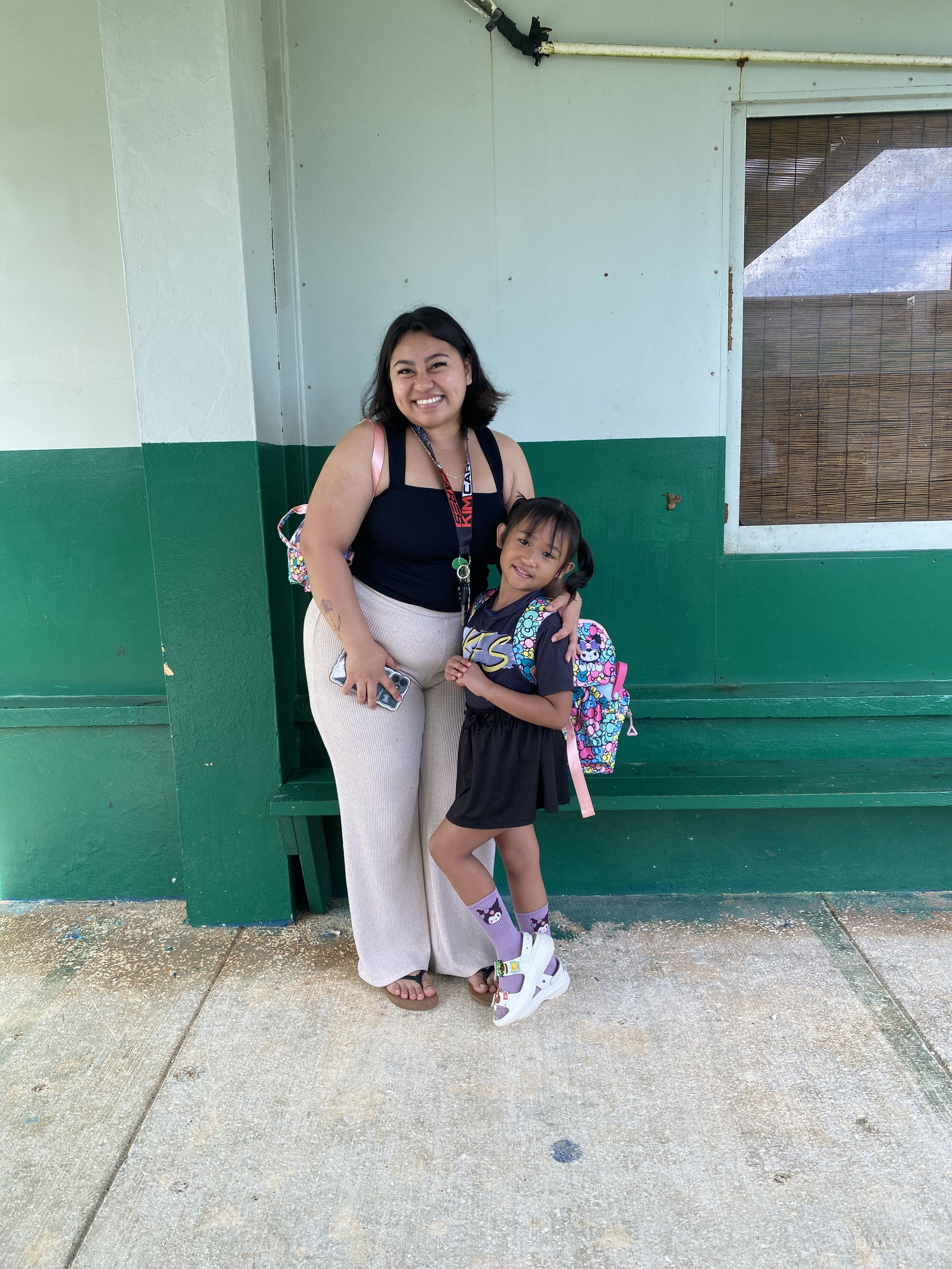 Kailani Camacho, left, dropped off her daughter, Kaeya Calage, on her first day of first grade.
