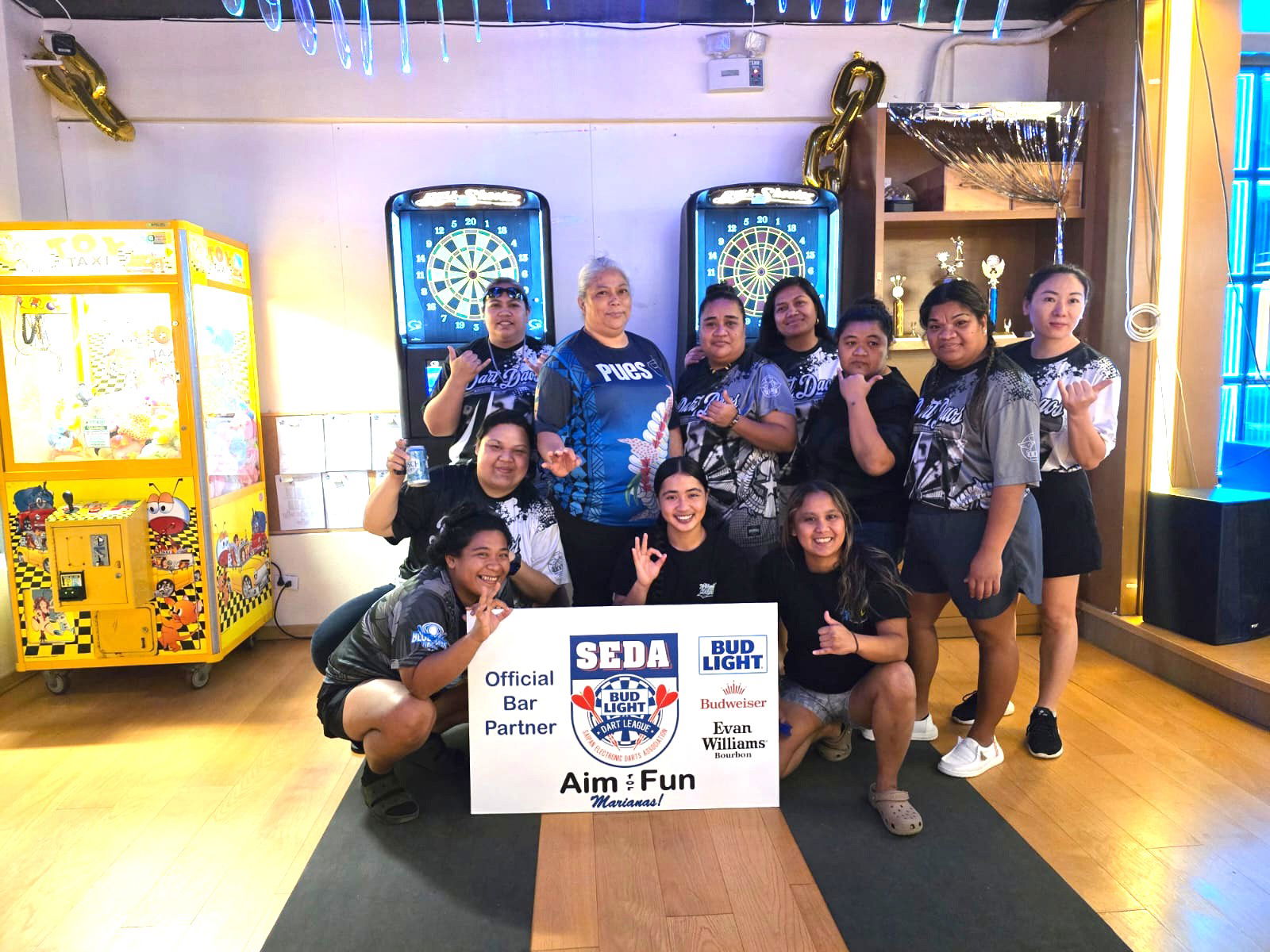 Tambayan Pues Ok and Bravo Dart Daos players pose for a group photo after their match in the ladies division of the 2025 SEDA Bud Light Dart League at Bravo Kitchen & Bar on Monday night.Contributed photo
