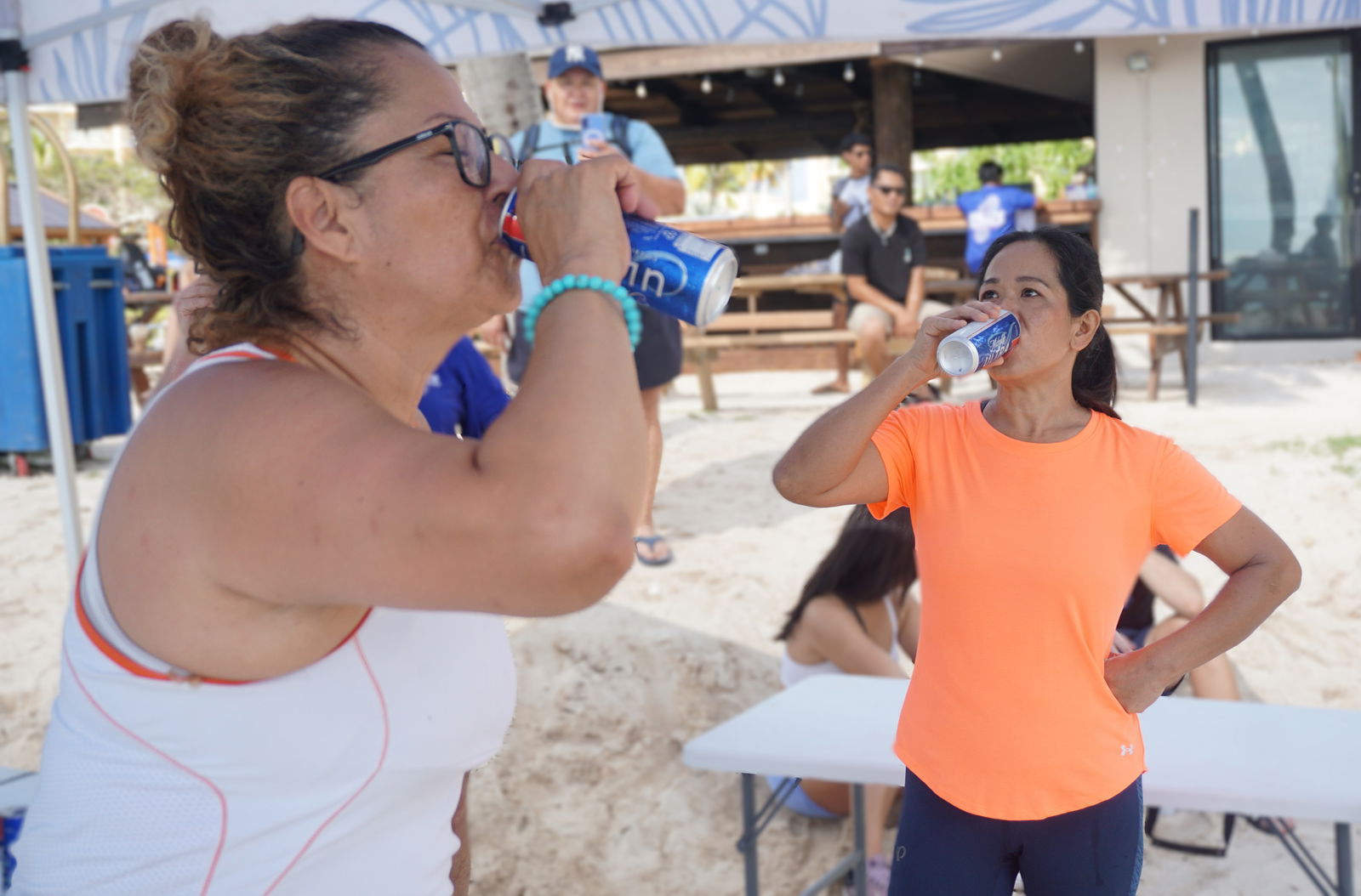 Rosemarie Chisato and another competitor chug their first can of Michelob Ultra.Photo by James F. Sablan Jr.