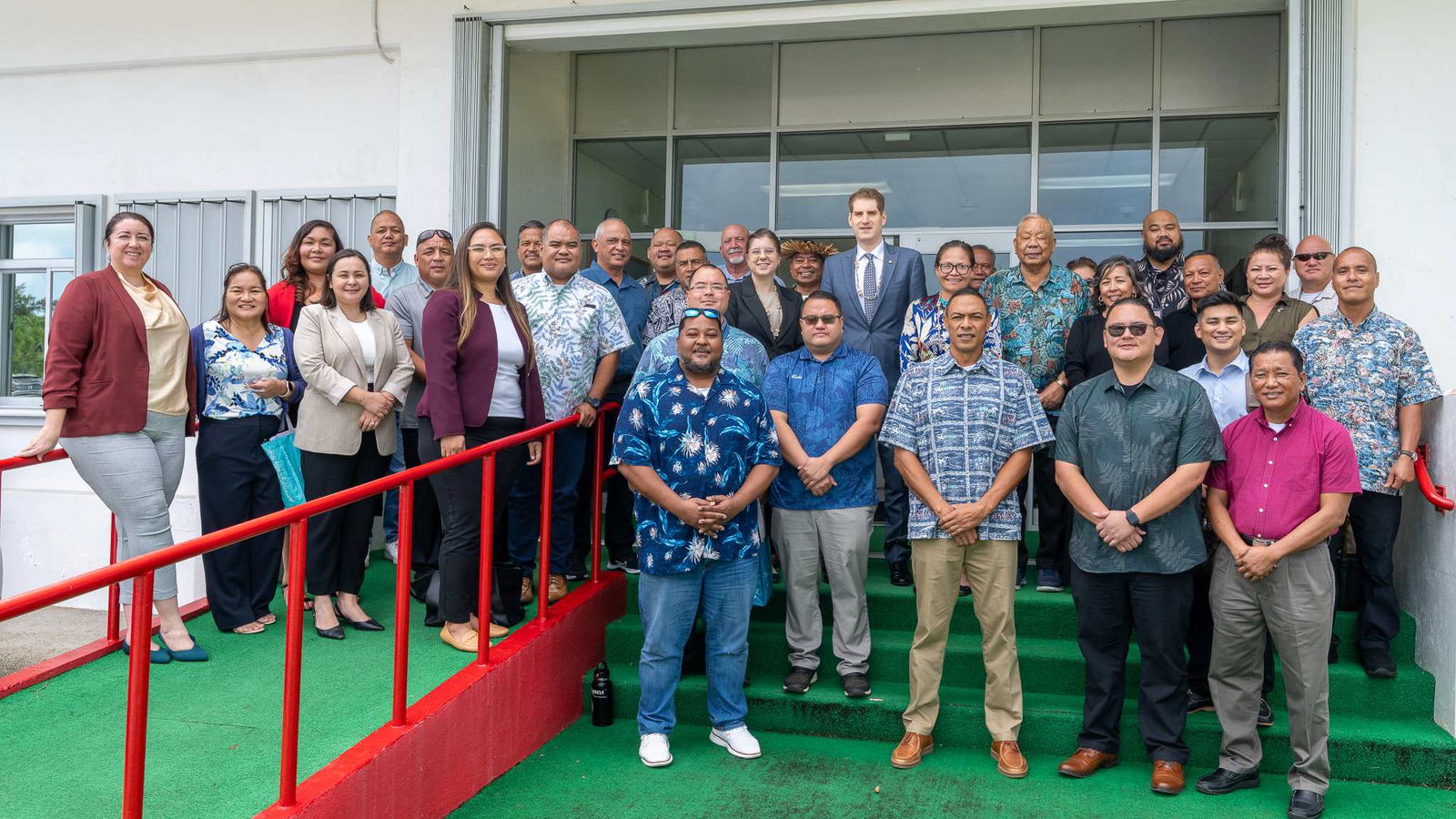 U.S. Department of Transportation Deputy Assistant Secretary for Aviation and International Affairs Jared Smith, center, Gov. David M. Apatang, Lt. Gov. Dennis James Mendiola, and U.S. Congresswoman Kimberlyn King-Hinds pose for a photo with CNMI lawmakers and other officials at the administration building on Capitol Hill after an initial discussion on transportation issues facing the CNMI.Office of the Governor photo
