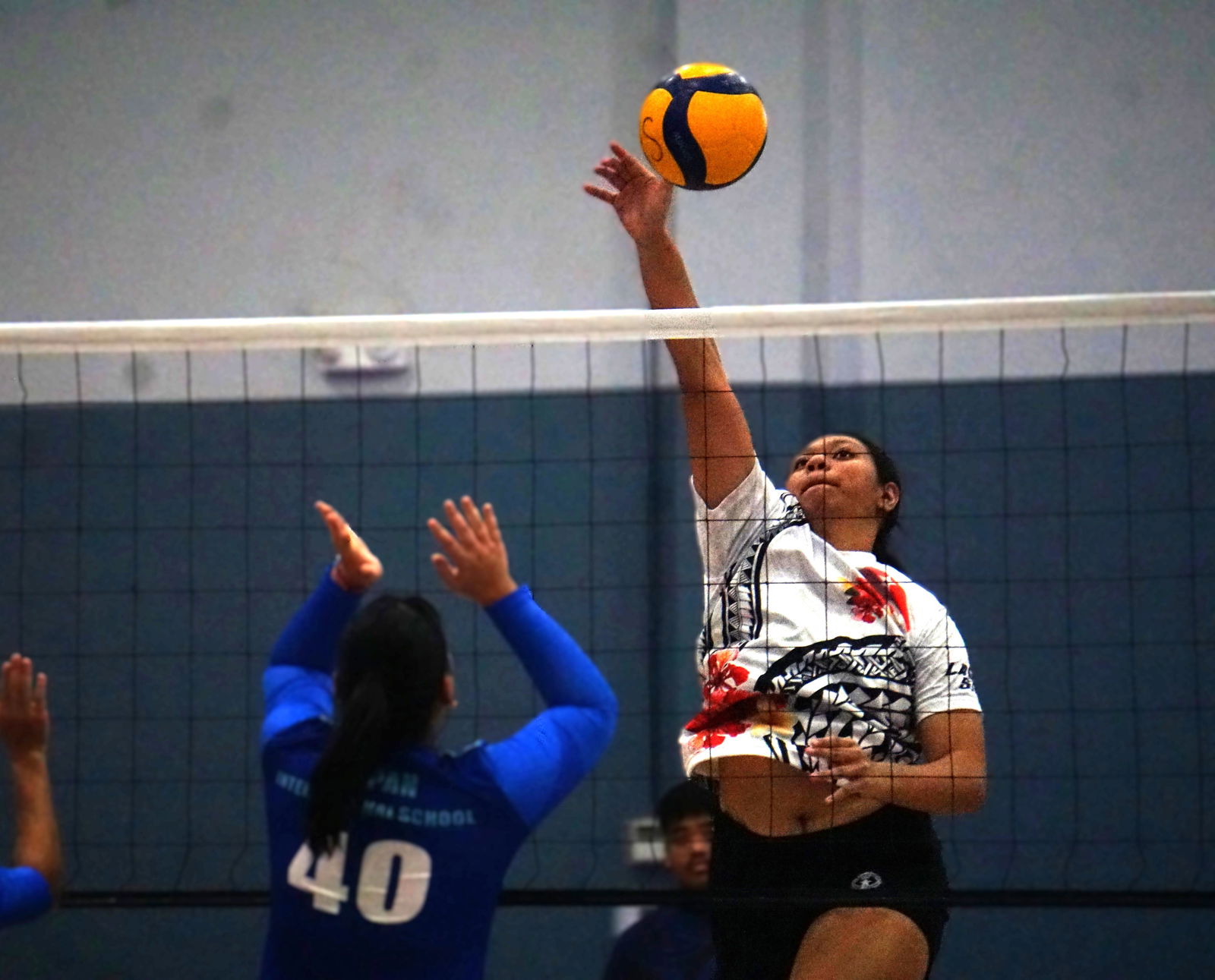 Lady Starz’s Azriel Fatialofa delivers a spike against the SIS Geckos in the women’s division of the 4 Starz Marianas Club 2nd Annual Fall Fest Volleyball Tournament Friday night at the Ada gym.