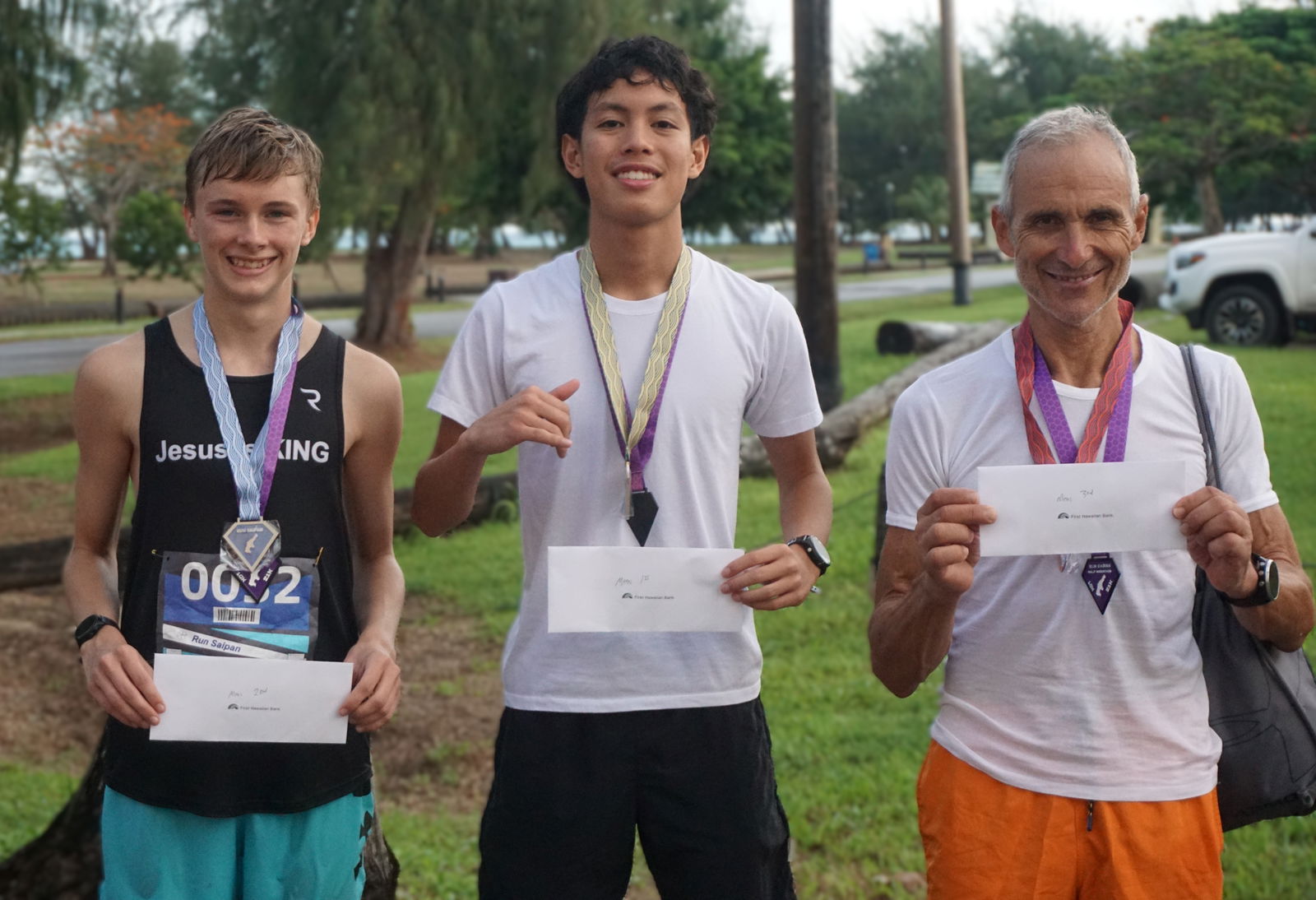 The top three men's division finishers are Landen Taflinger, Victor Nash Santos, and Jun Kawano.