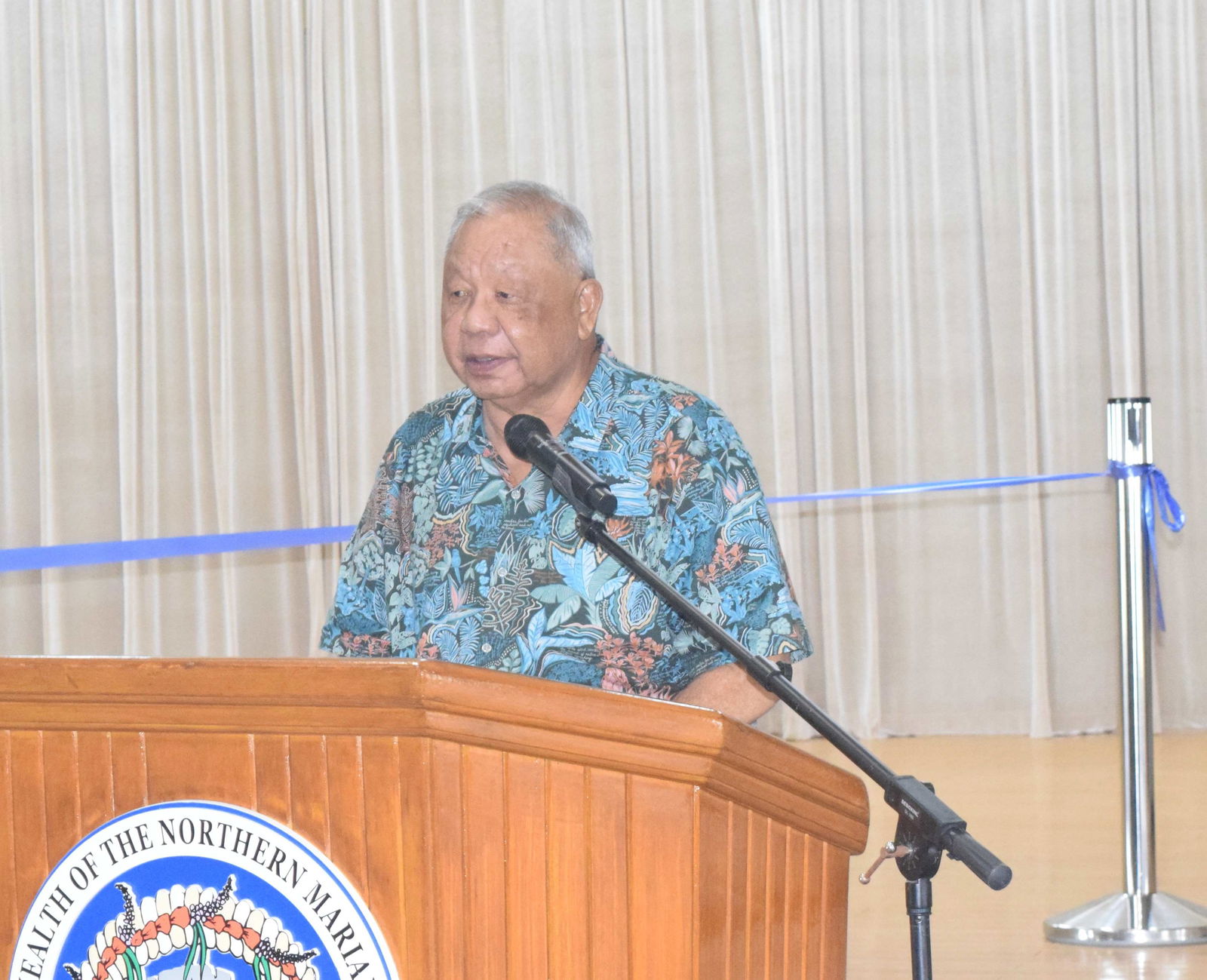 Gov. David M. Apatang delivers his special remarks during the ribbon-cutting ceremony for the 60-kilowatt solar power system at the multi-purpose center on Friday.