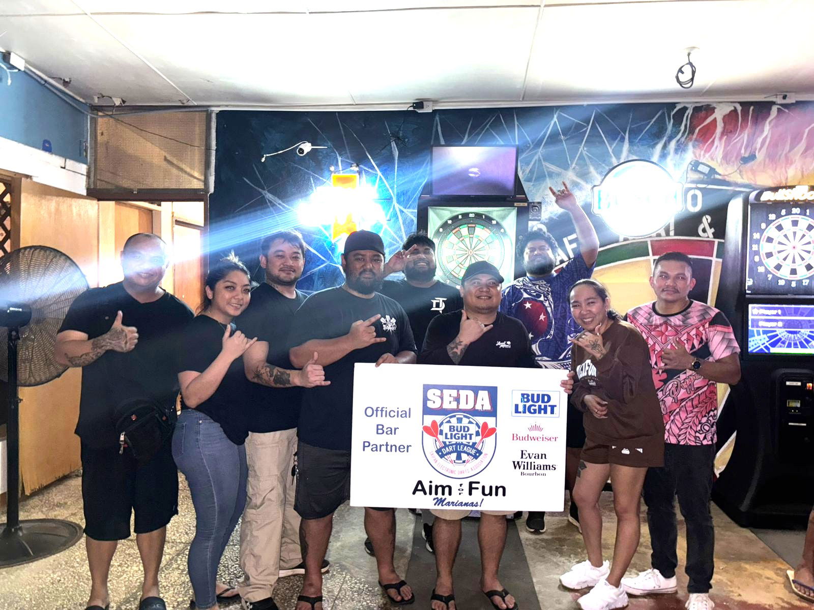 True North Cherry Popperz and Last Shot Hobbies Score Horse players pose for a group photo after their match in the Chichirika C division of the 2025 SEDA Bud Light Dart League at the True North Bar on Wednesday night.Contributed photo
