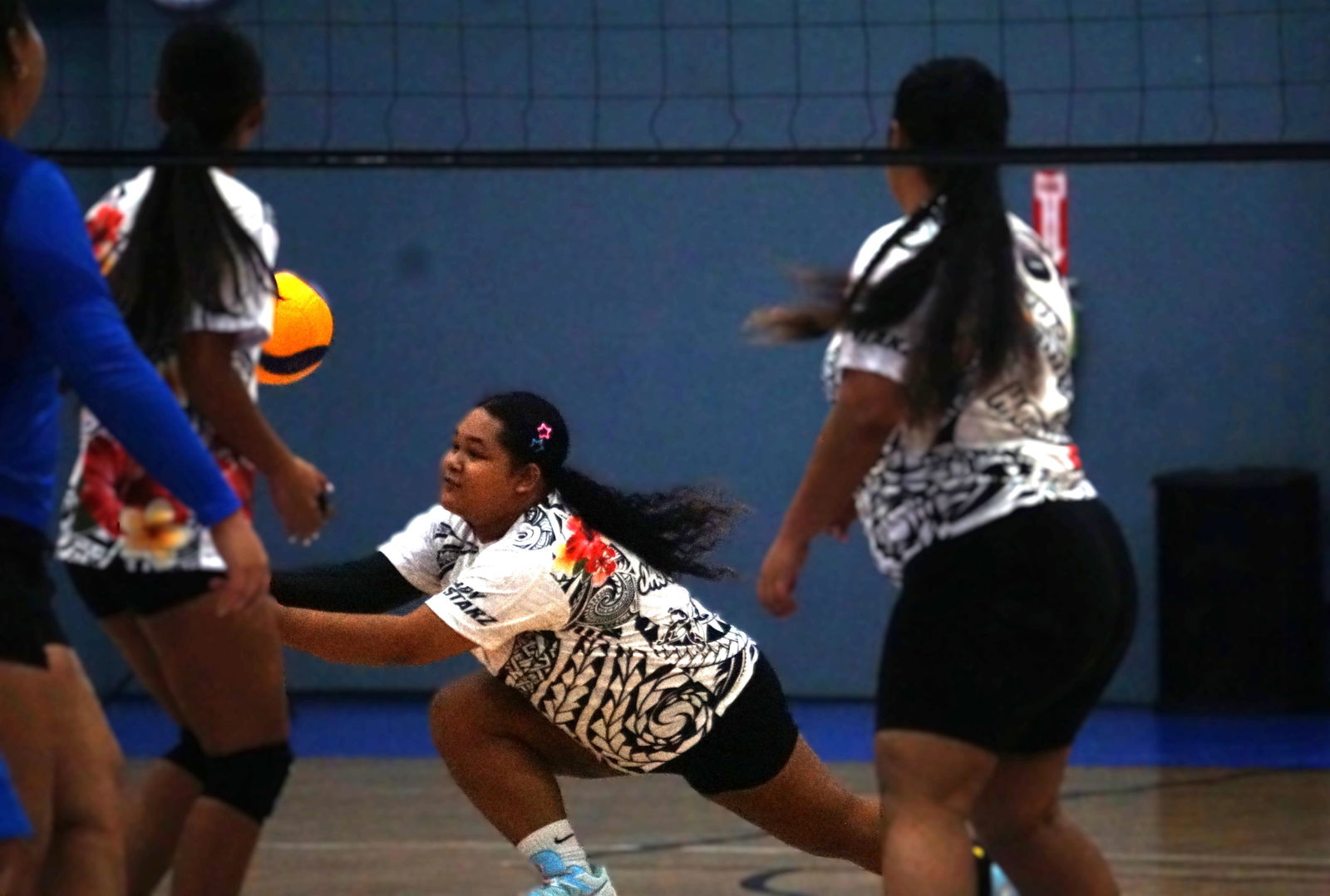 Lady Starz player Jasmine John dives to save possession during a game against the SIS Geckos in the women’s division of the 4 Starz Marianas Club 2nd Annual Fall Fest Volleyball Tournament 2025  Friday night at the Ada gym.