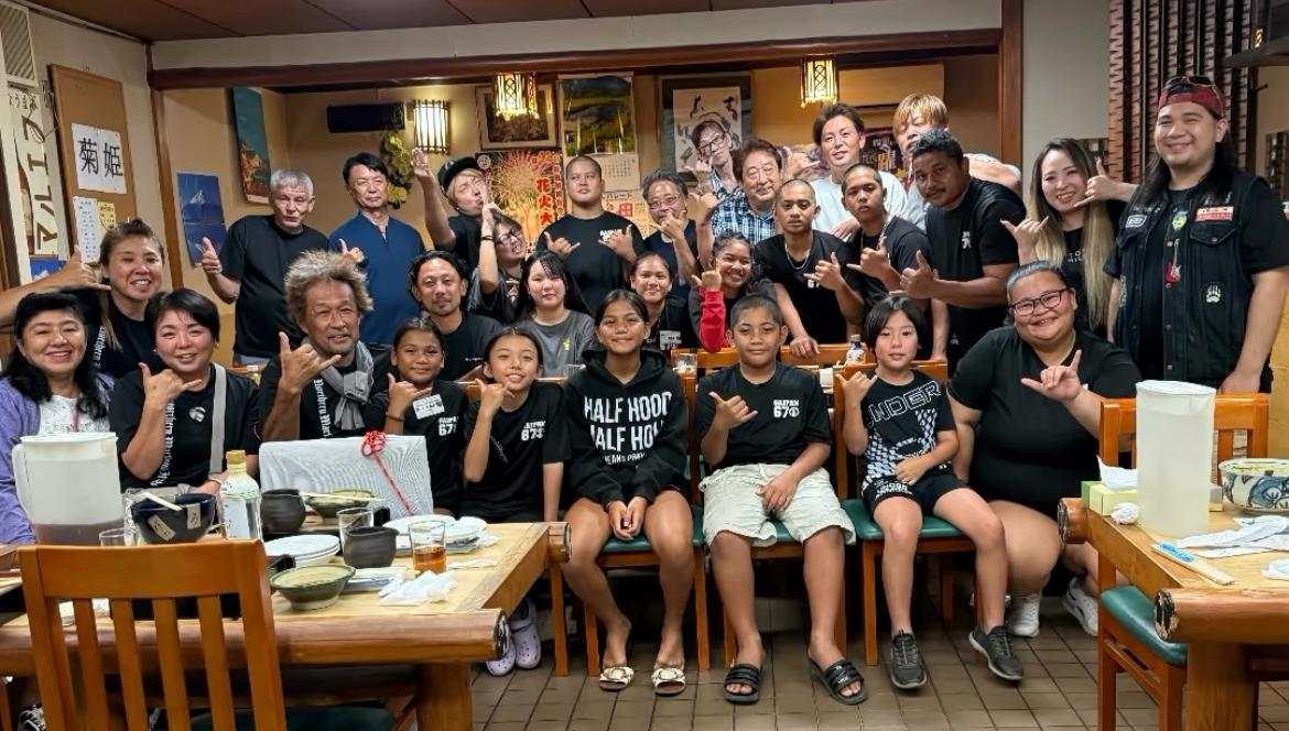 The Saipan-ren Awaodori dancers with Noda City couple, Mr. and Mrs. Fujii, and other Noda City residents. Also in photo is Saipan Awaodori founder, Misako Kamata, left, seated.
