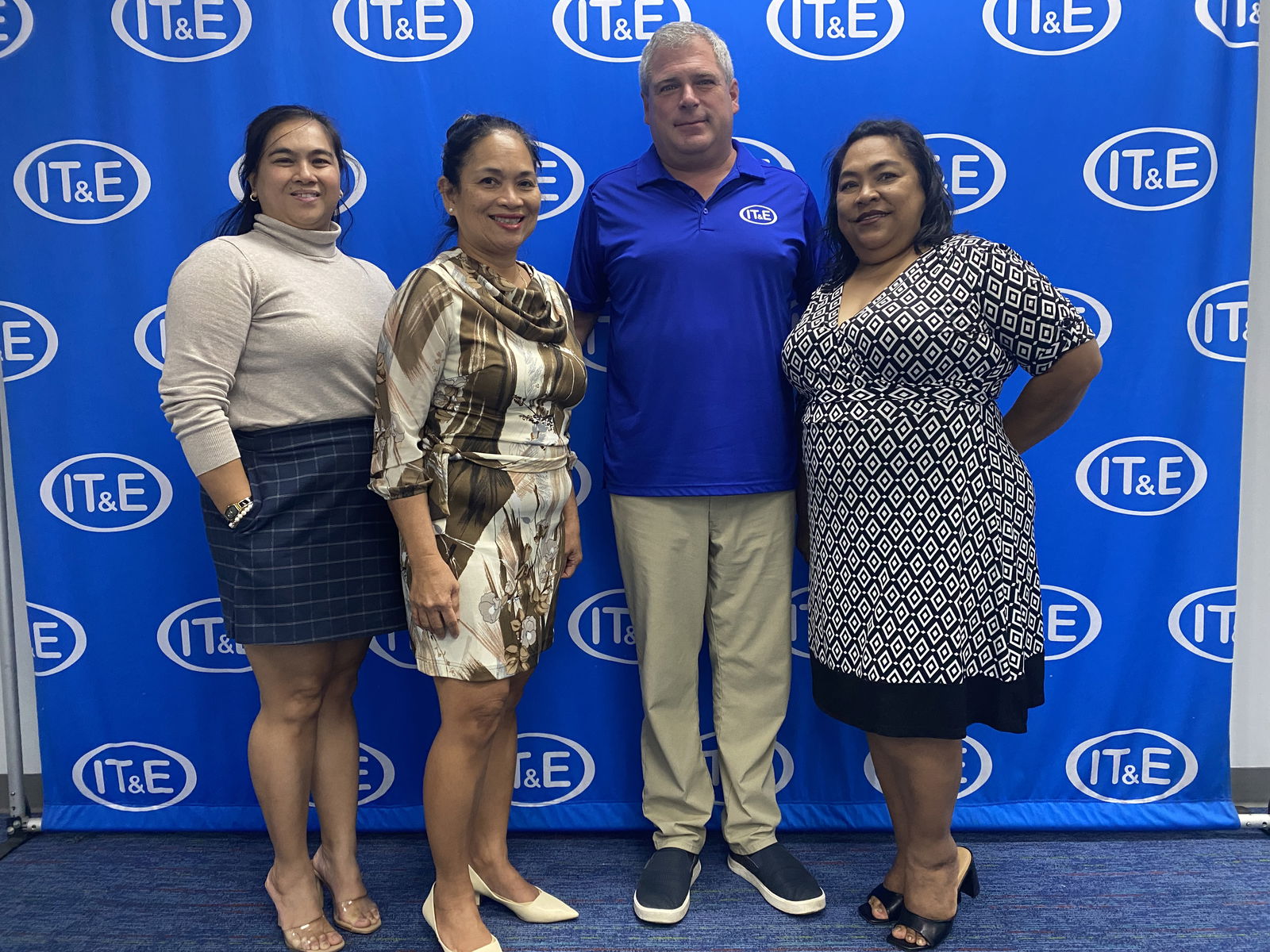 From left, Carisse Vendiola, IT&E chief commercial officer; Velma Palacios, senior director for the CNMI; CEO David Gibson; and Janice Tenorio, senior manager for government relations & customer Service pose for a photo at the IT&E central office in Susupe on Tuesday, Aug. 26, 2025.