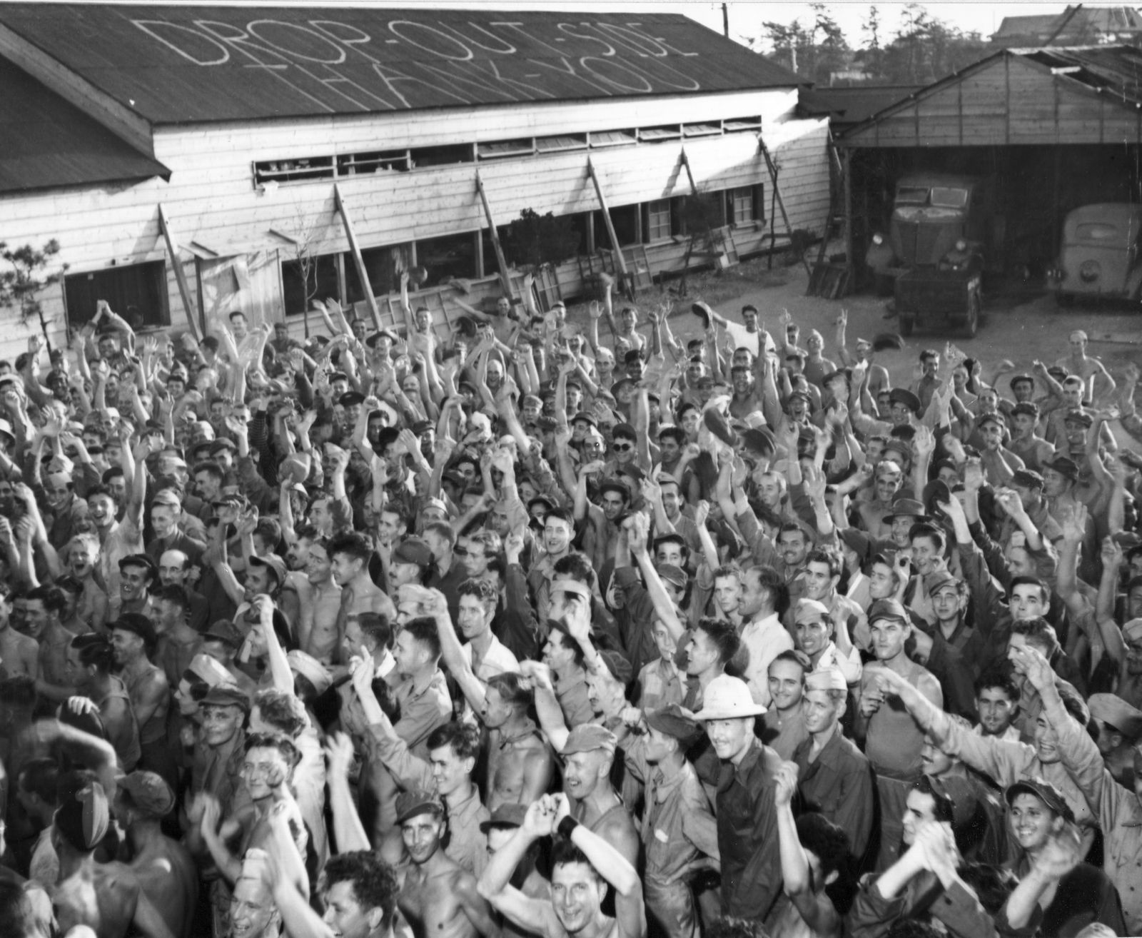 POWs at Aomori camp near Yokohama cheer rescuers from the U.S. Navy.
