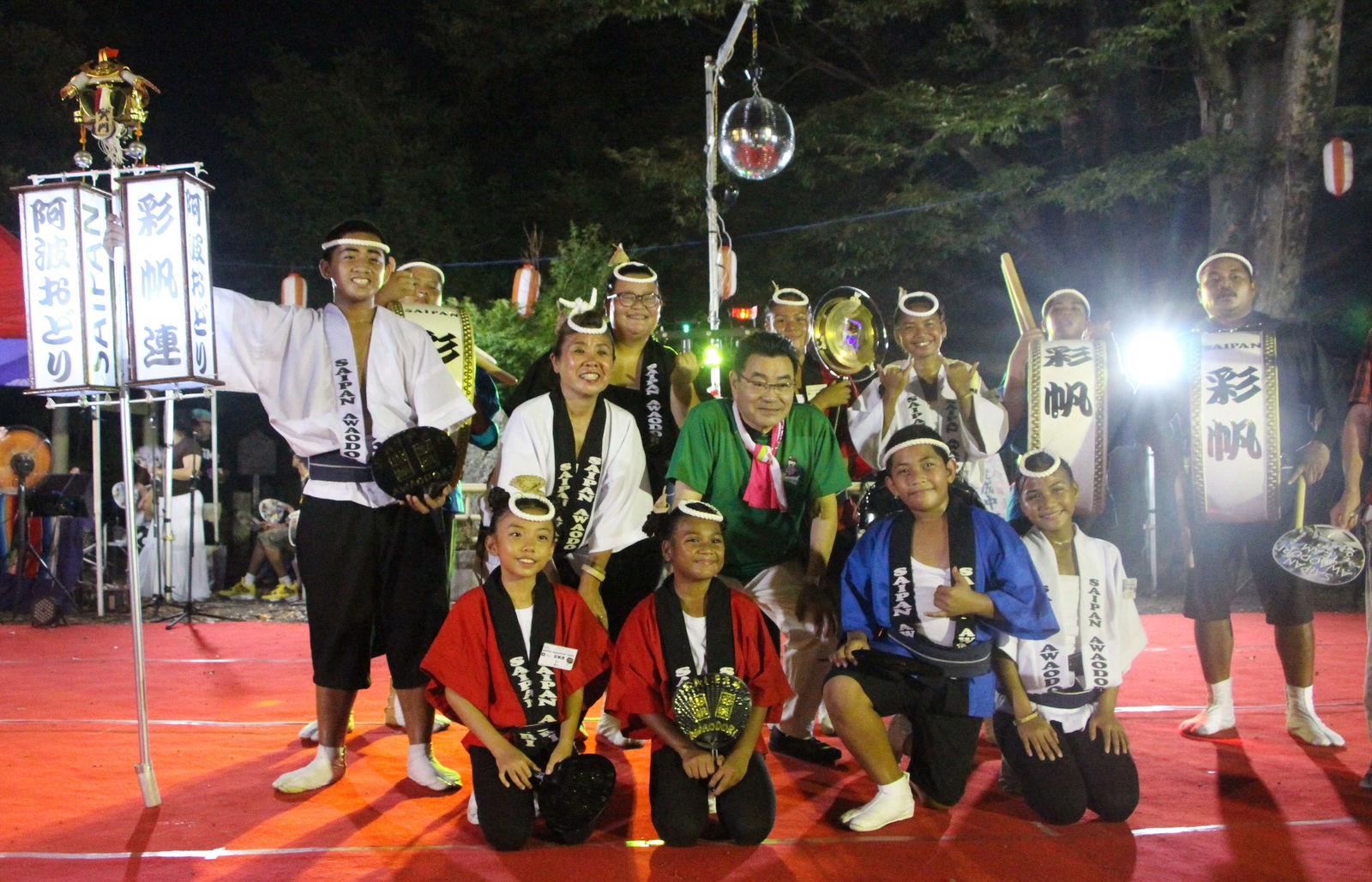 Noda City Mayor Yuu Suzuki, center, poses with Saipan-ren Awadori dancers.