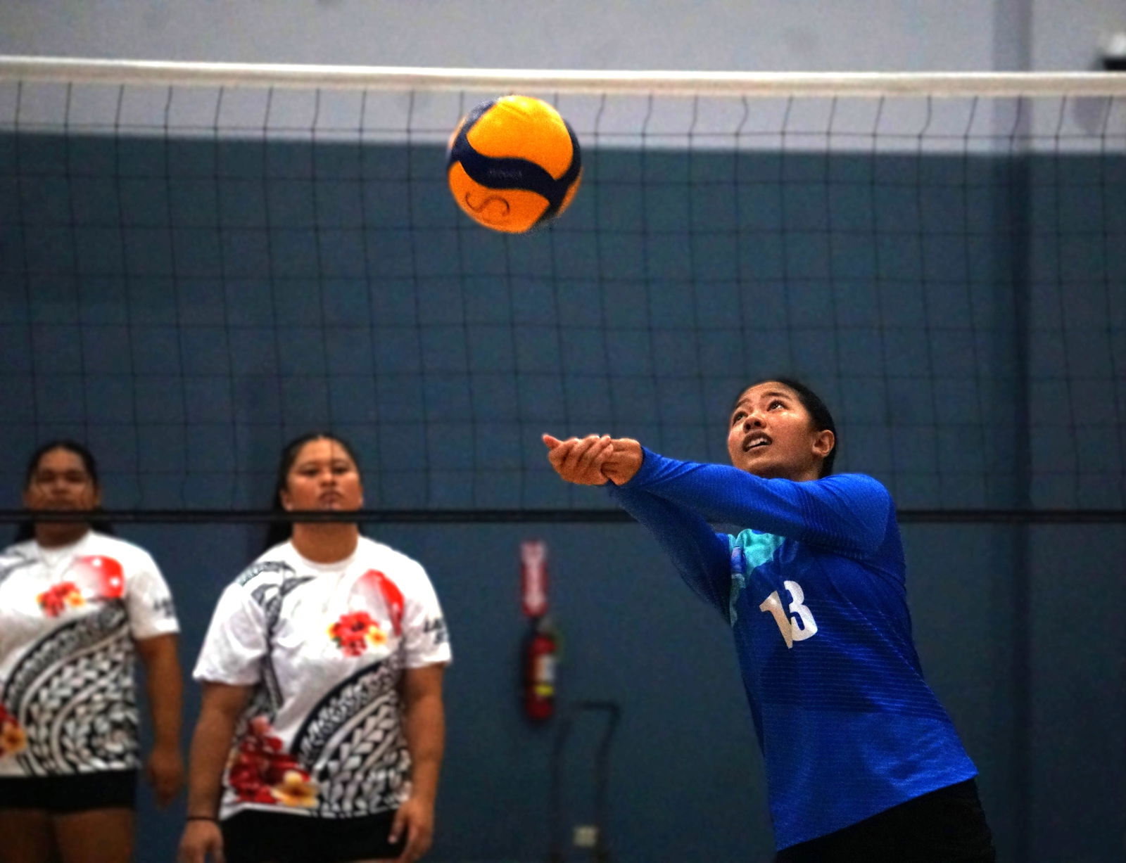 An SIS player executes a bump return during a game against the Lady Starz in the women’s division of the 4 Starz Marianas Club 2nd Annual Fall Fest Volleyball Tournament Friday night at the Ada gym.