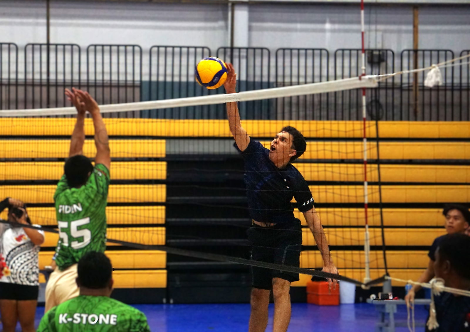 4-Starz’s Maui Taijeron spikes against Tekison Warriors in the men’s division of the 2nd Annual Fall Fest Volleyball Tournament at the Ada gym Friday night.