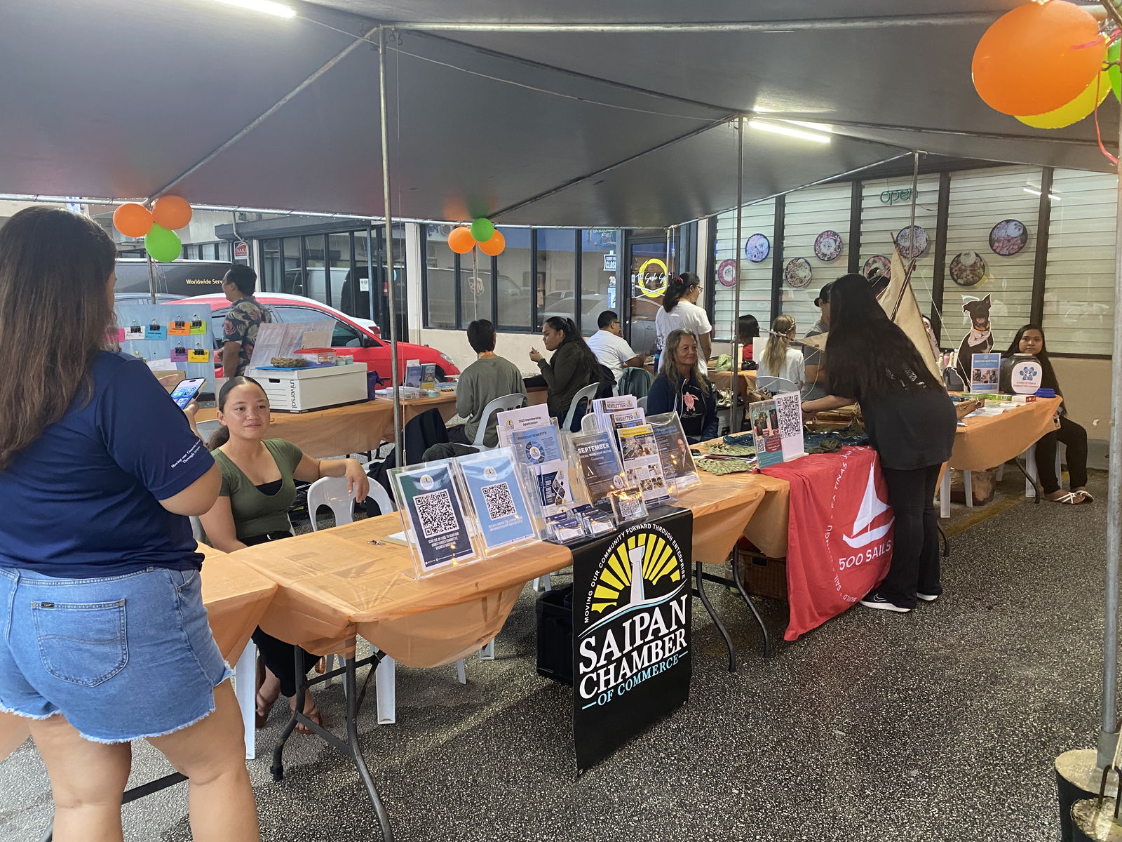 MANGO members set up exhibit tables outside the organization’s office.